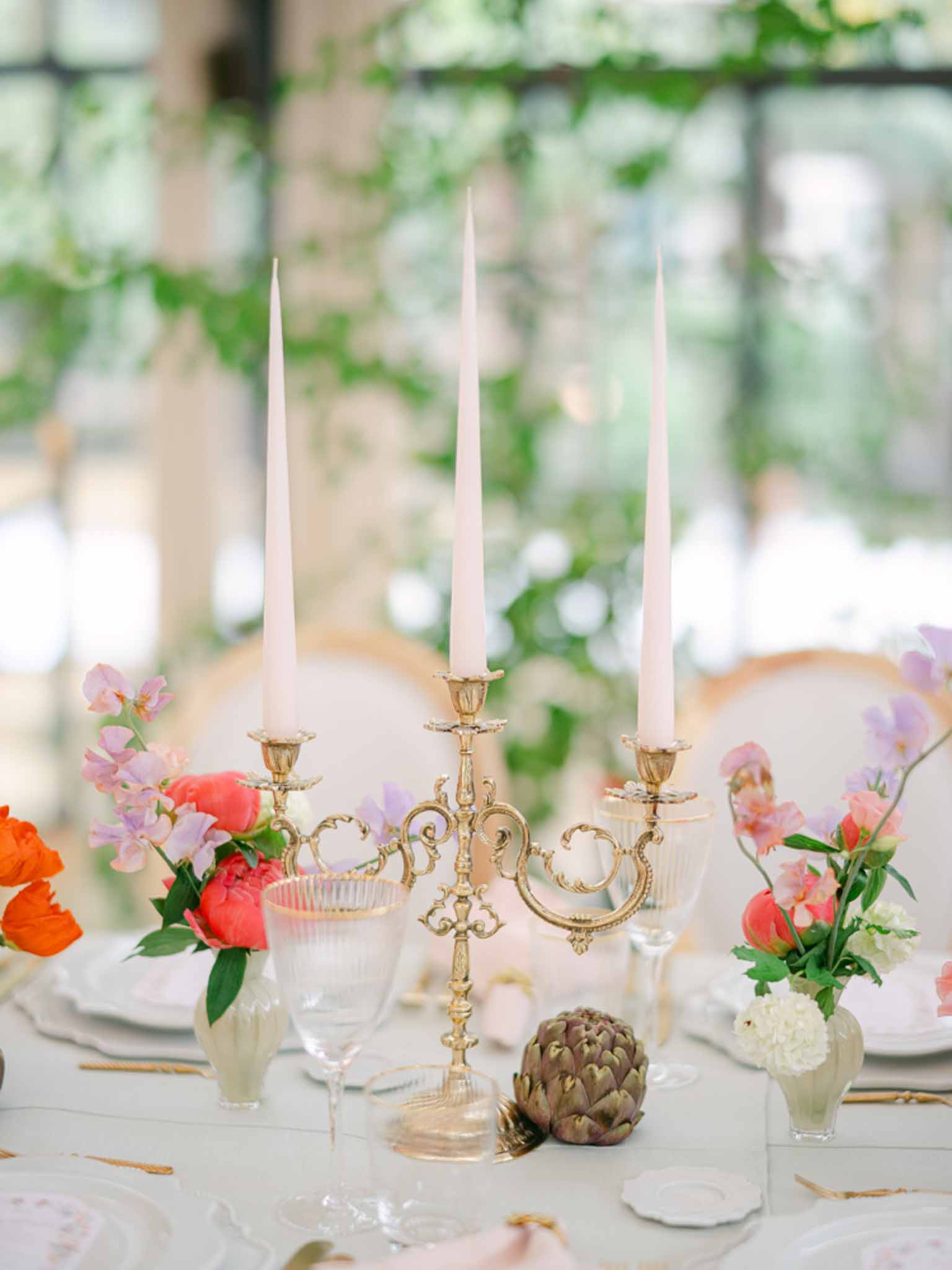 Wedding reception table setting in a garden with peonies