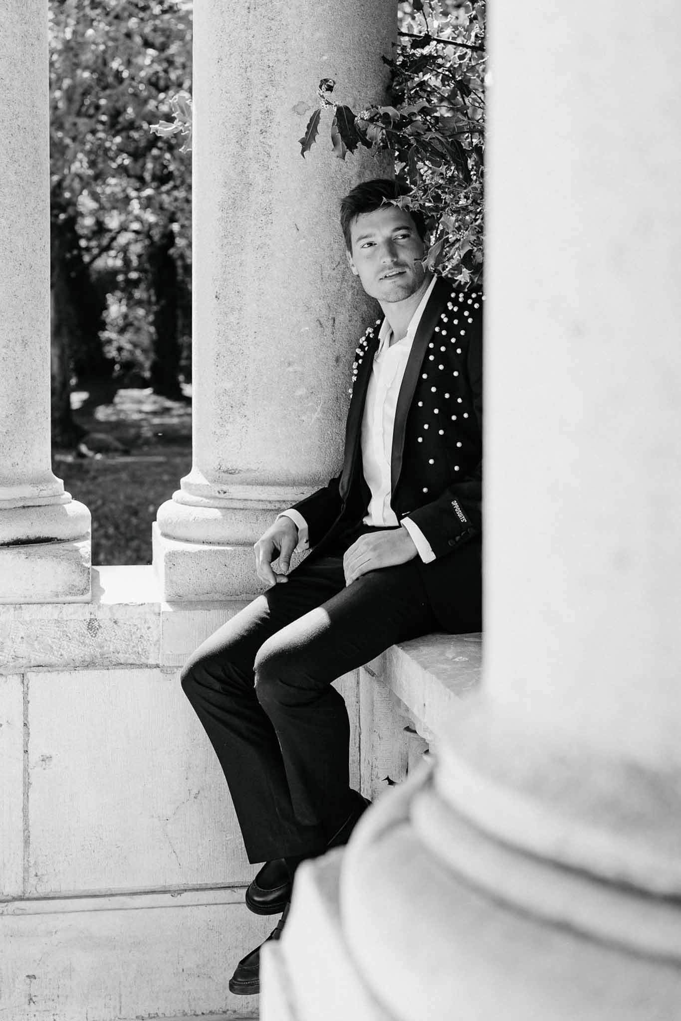Black and white photo of bridal shoes in a garden