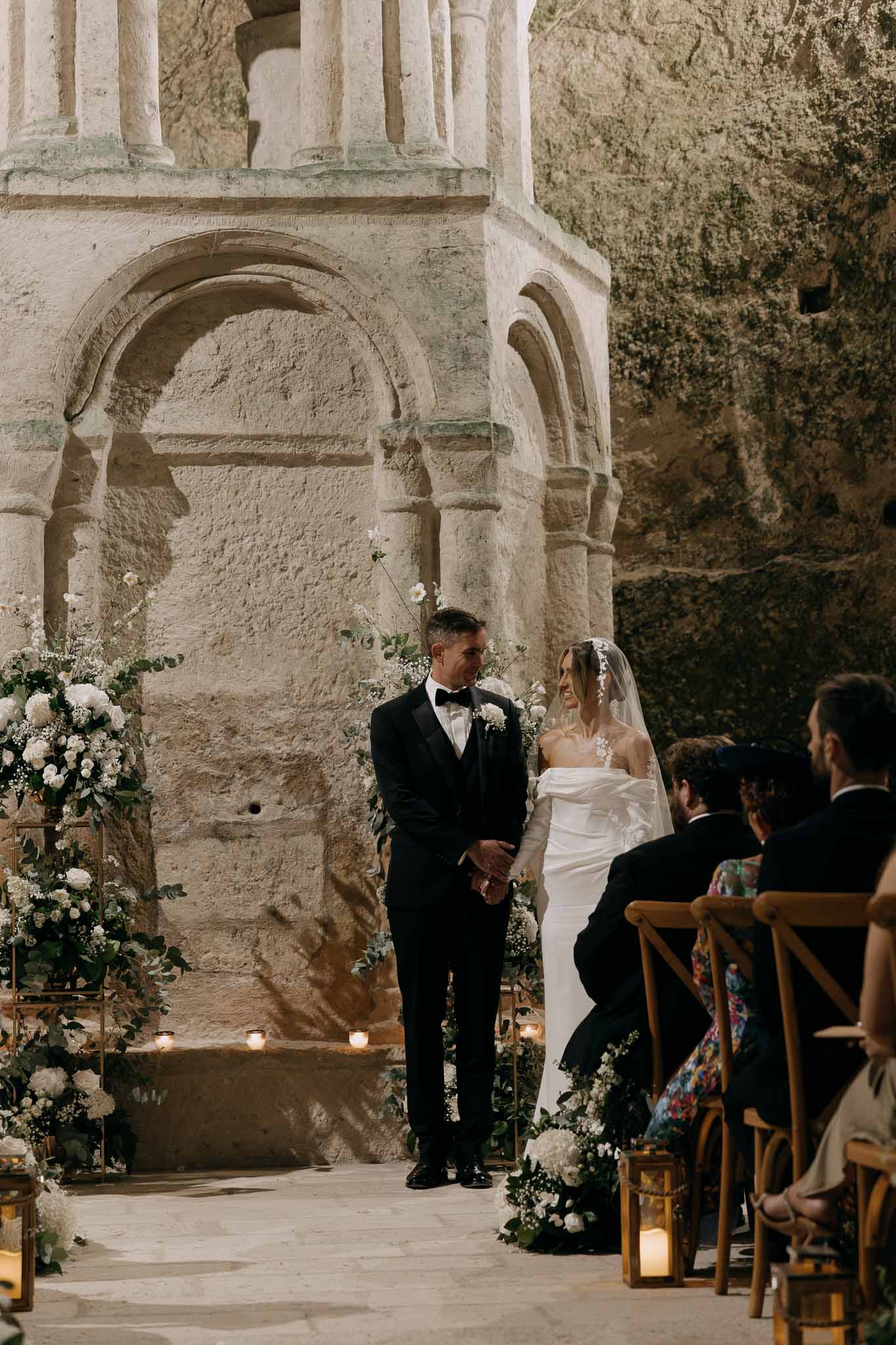 Wedding ceremony in a chapel with white roses