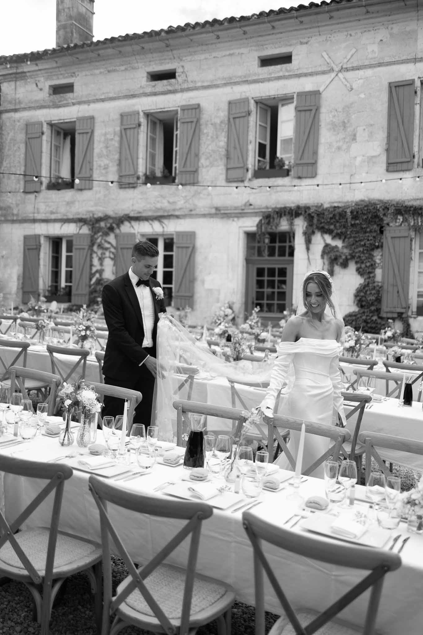 Black and white photo of wedding reception table setting