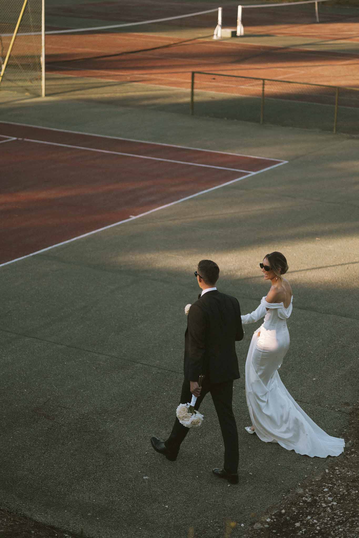 Bride and groom walking hand in hand