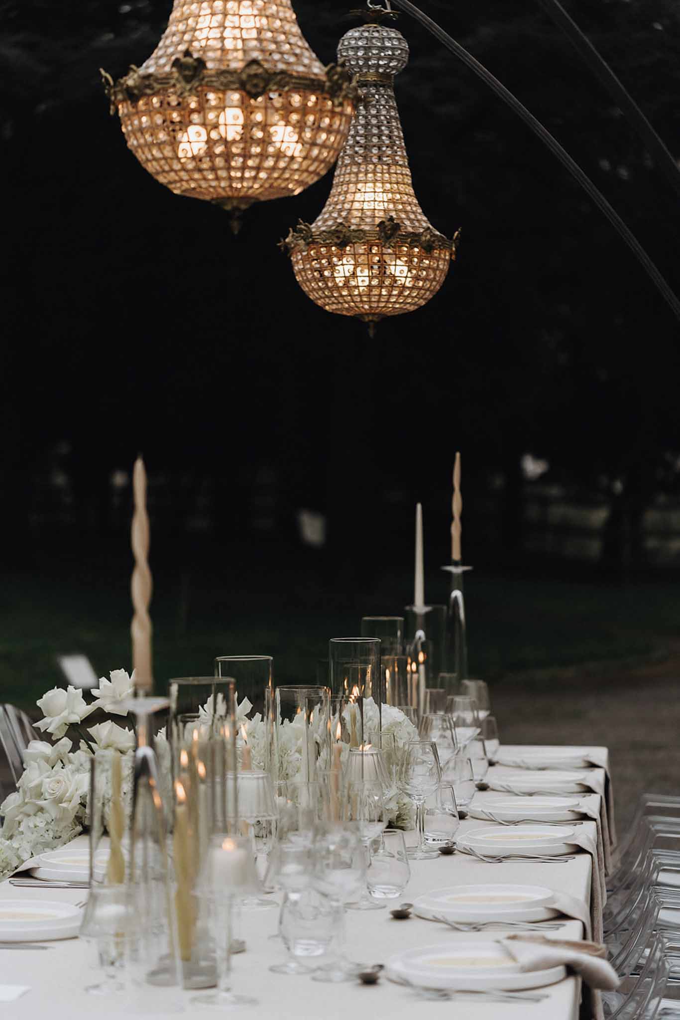 Wedding reception table setting with white roses