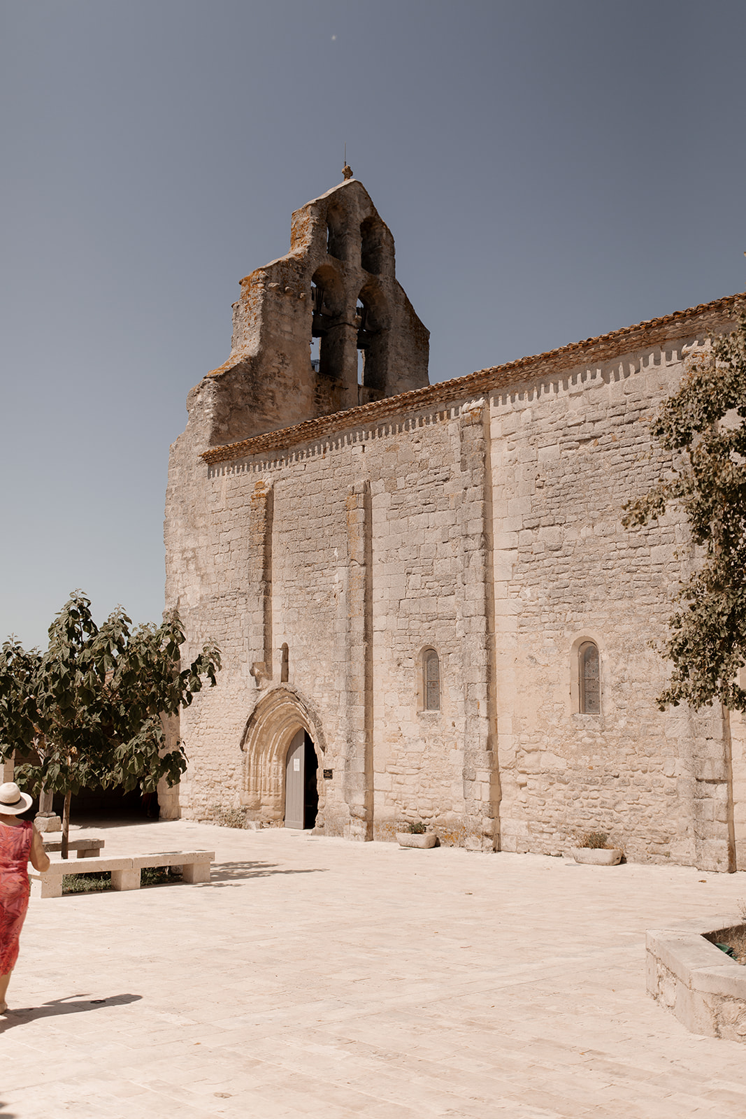 Historic stone chapel with bell tower and arched entrance at wedding venue