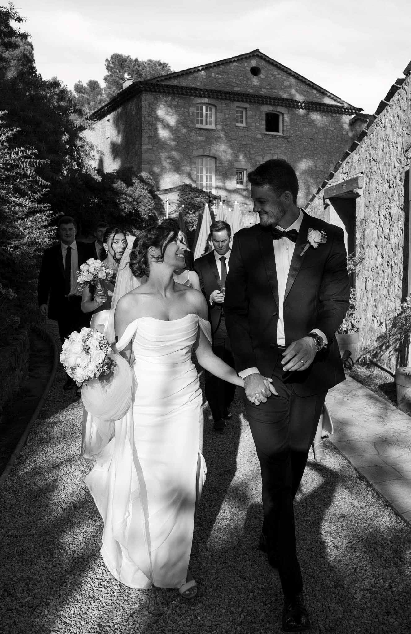 Black and white photo of wedding ceremony with white roses