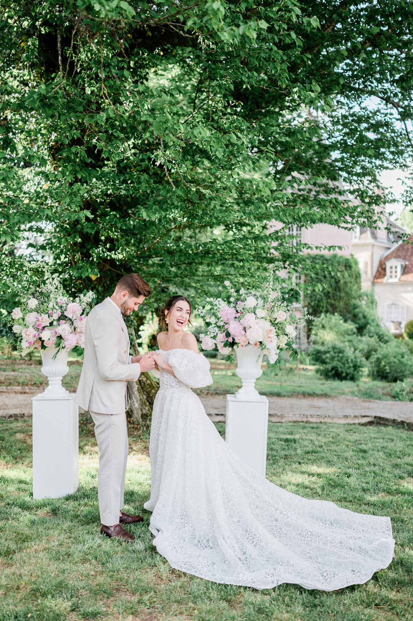 Bride and groom portrait session in garden setting with classical mansion background