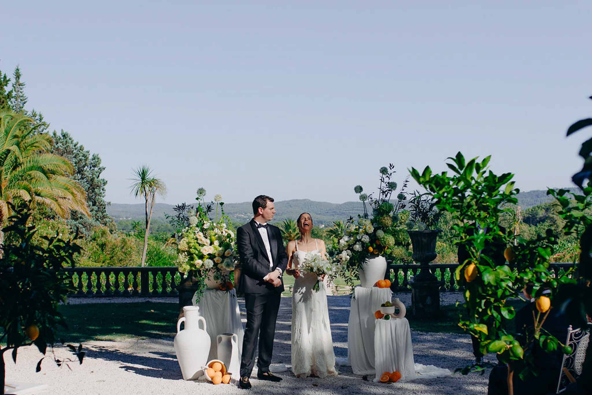 Wedding ceremony in a garden with white roses