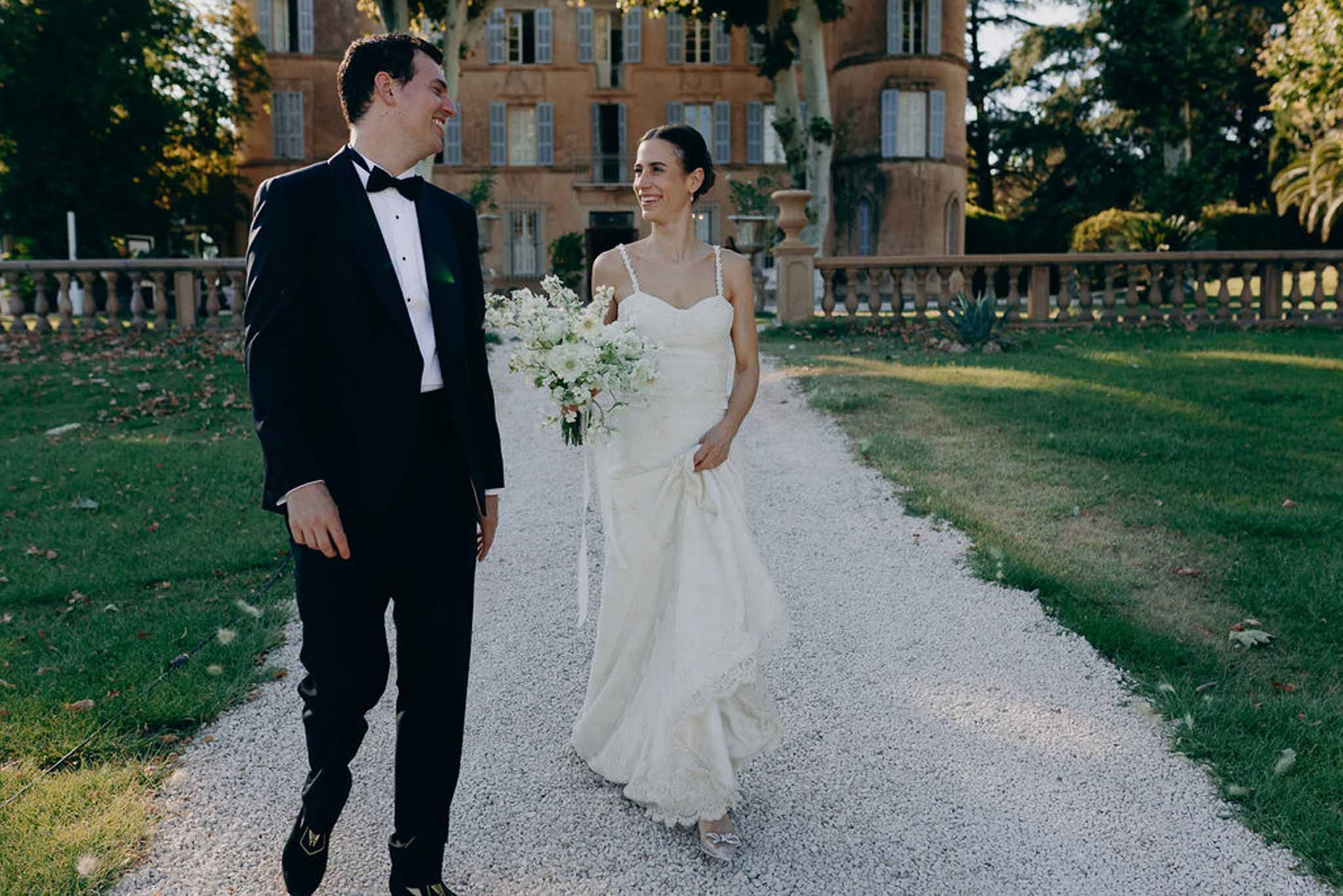 Bride and groom walking hand in hand