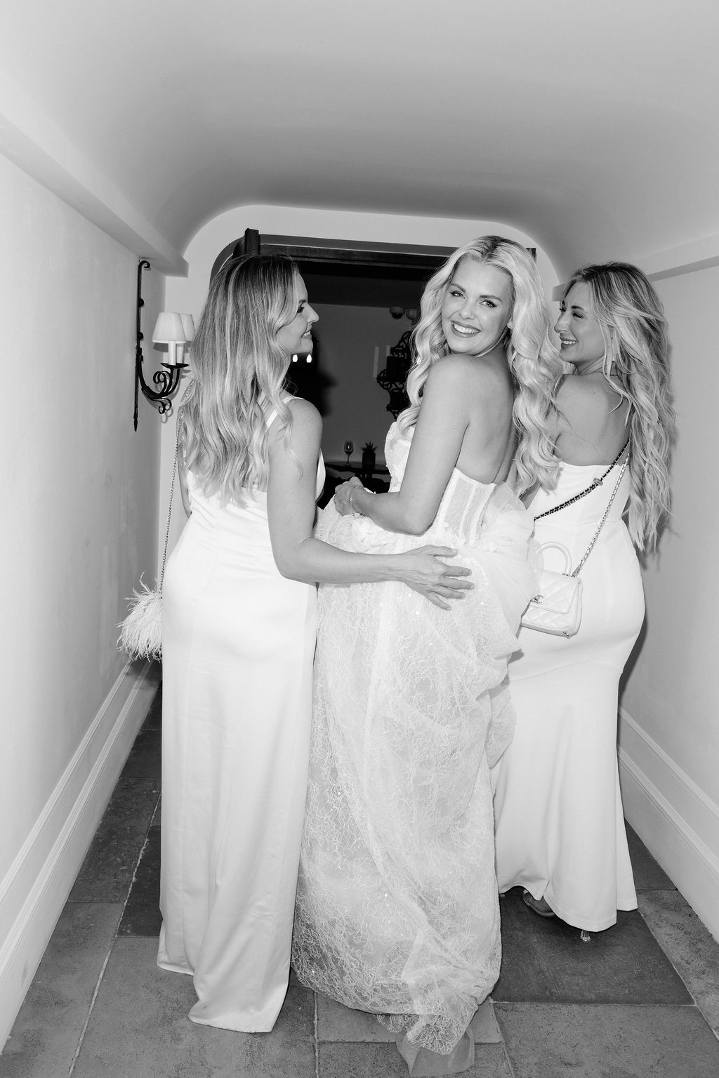Bride and bridesmaids laughing together at Airelles Gordes La Bastide, Provence