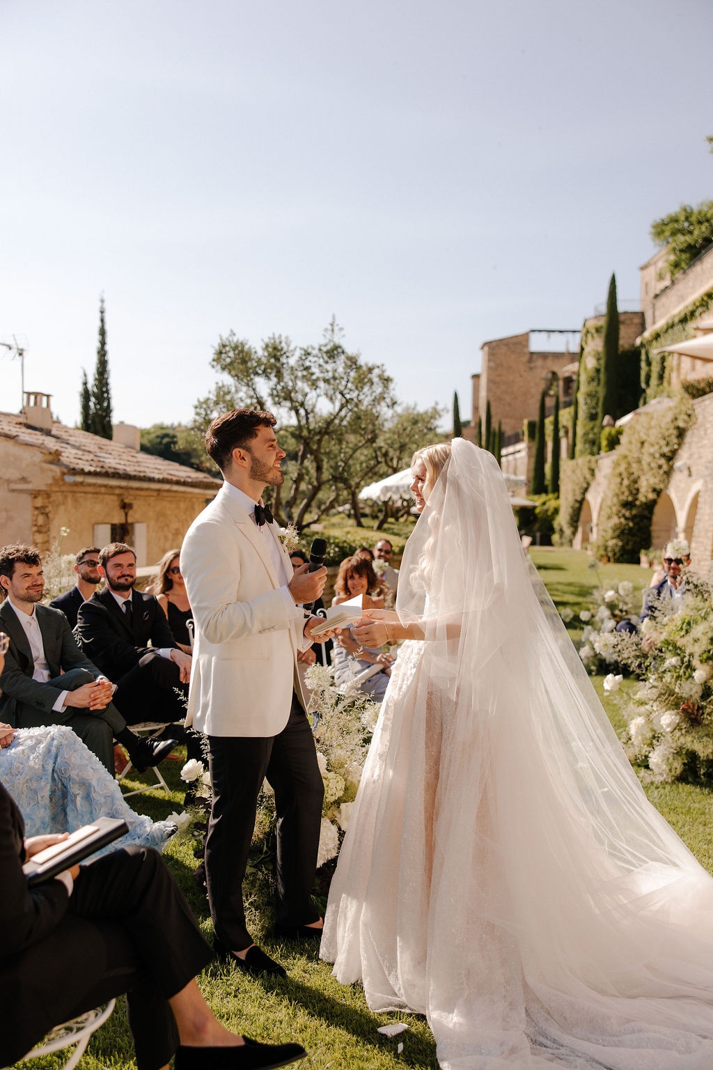 Couple reading vows during ceremony at Airelles Gordes La Bastide, Provence