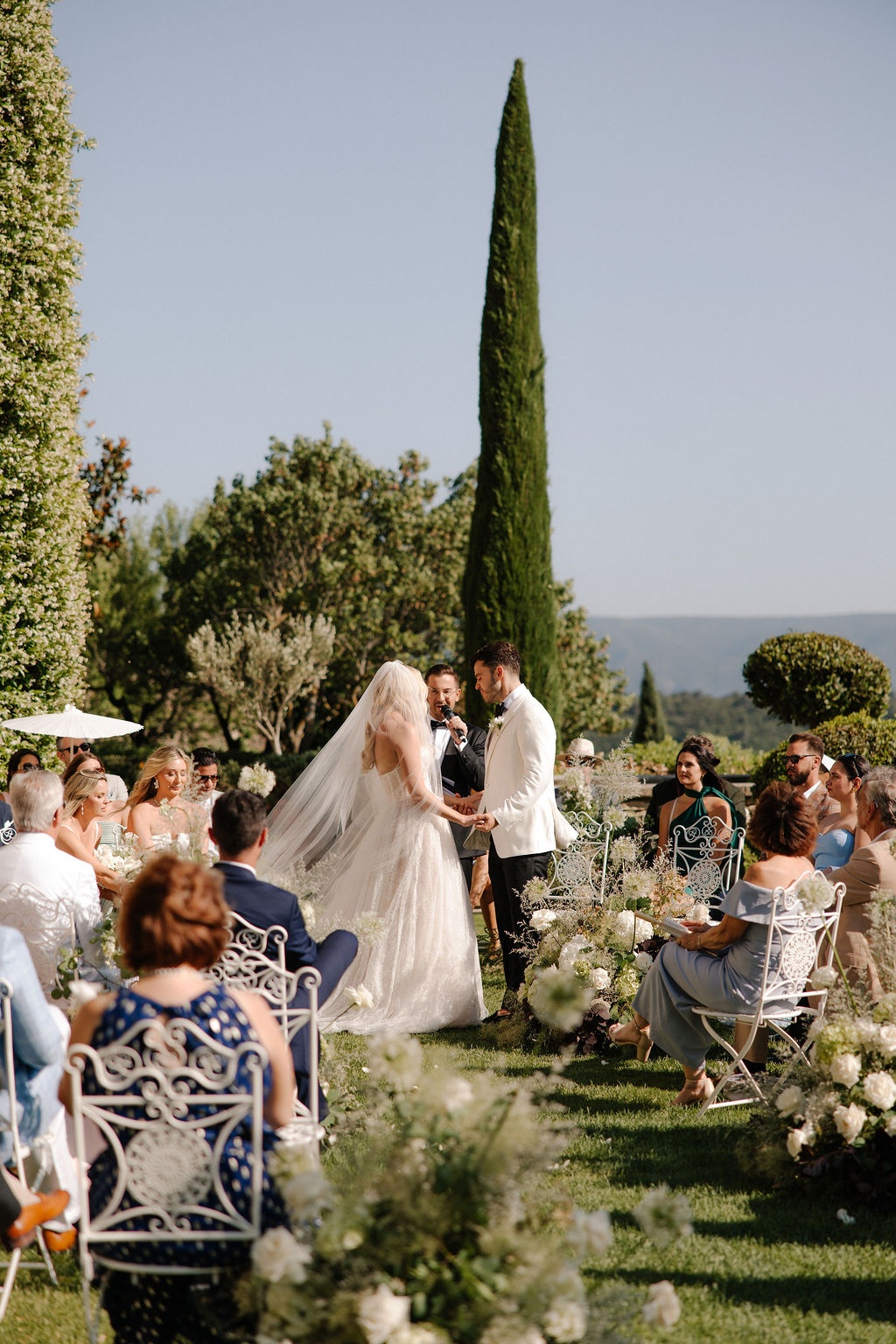 Wide ceremony view with cypress trees at Airelles Gordes La Bastide, Provence