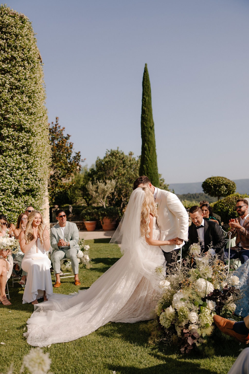 Couple share first kiss at altar at Airelles Gordes La Bastide, Provence