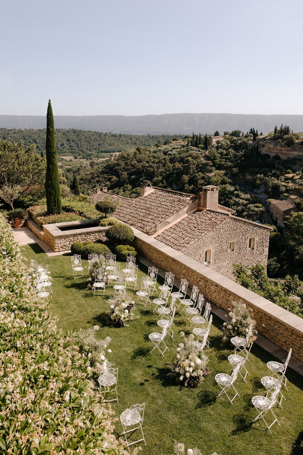 Semi-circle ceremony setup with valley view at Airelles Gordes La Bastide, Provence