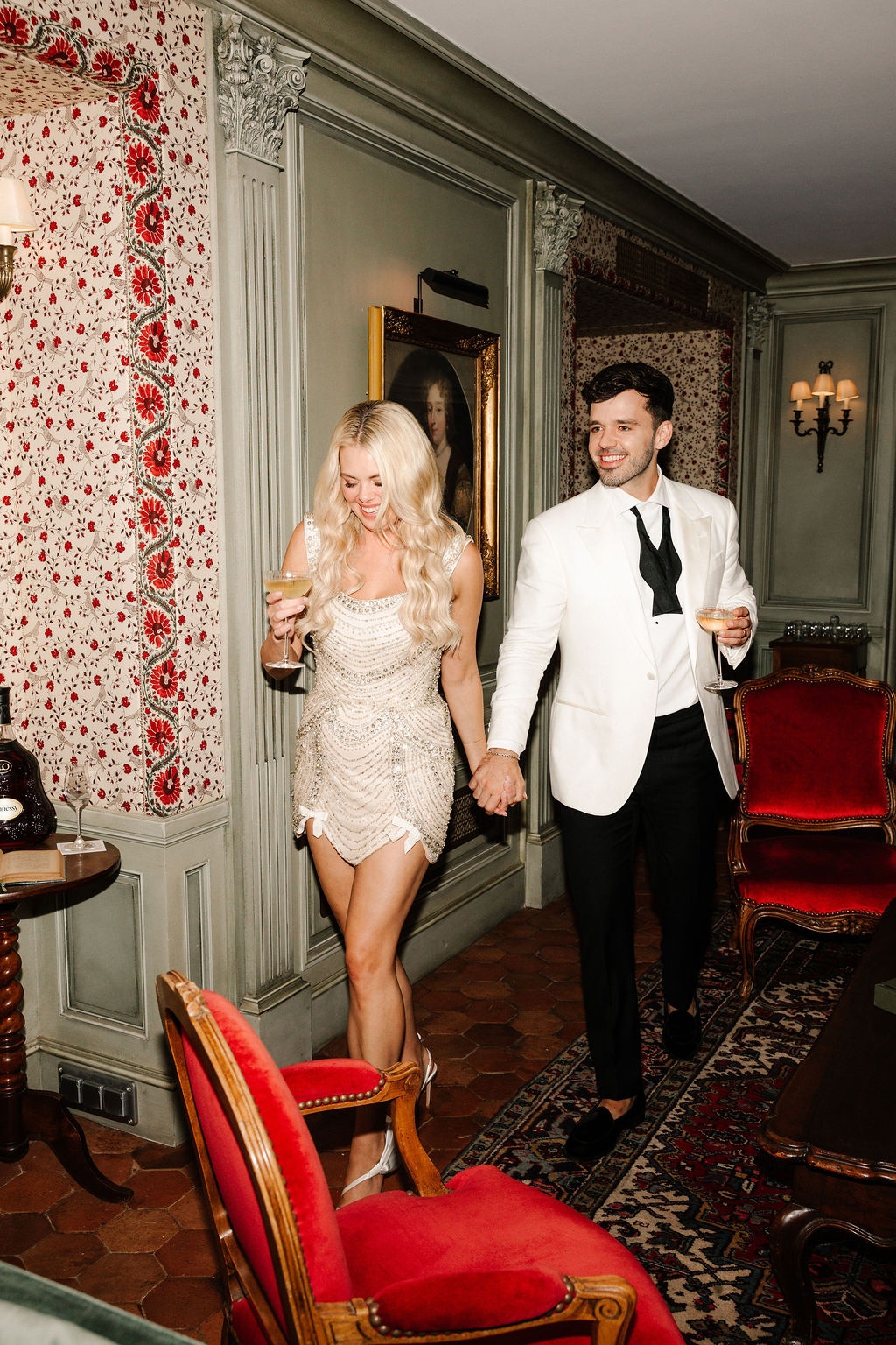 Bride and groom with cocktails at Airelles Gordes La Bastide, Provence