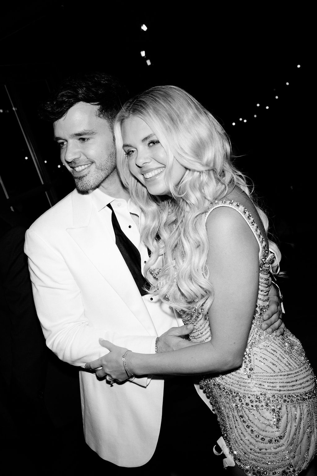 Black and white couple embrace at Airelles Gordes La Bastide, Provence