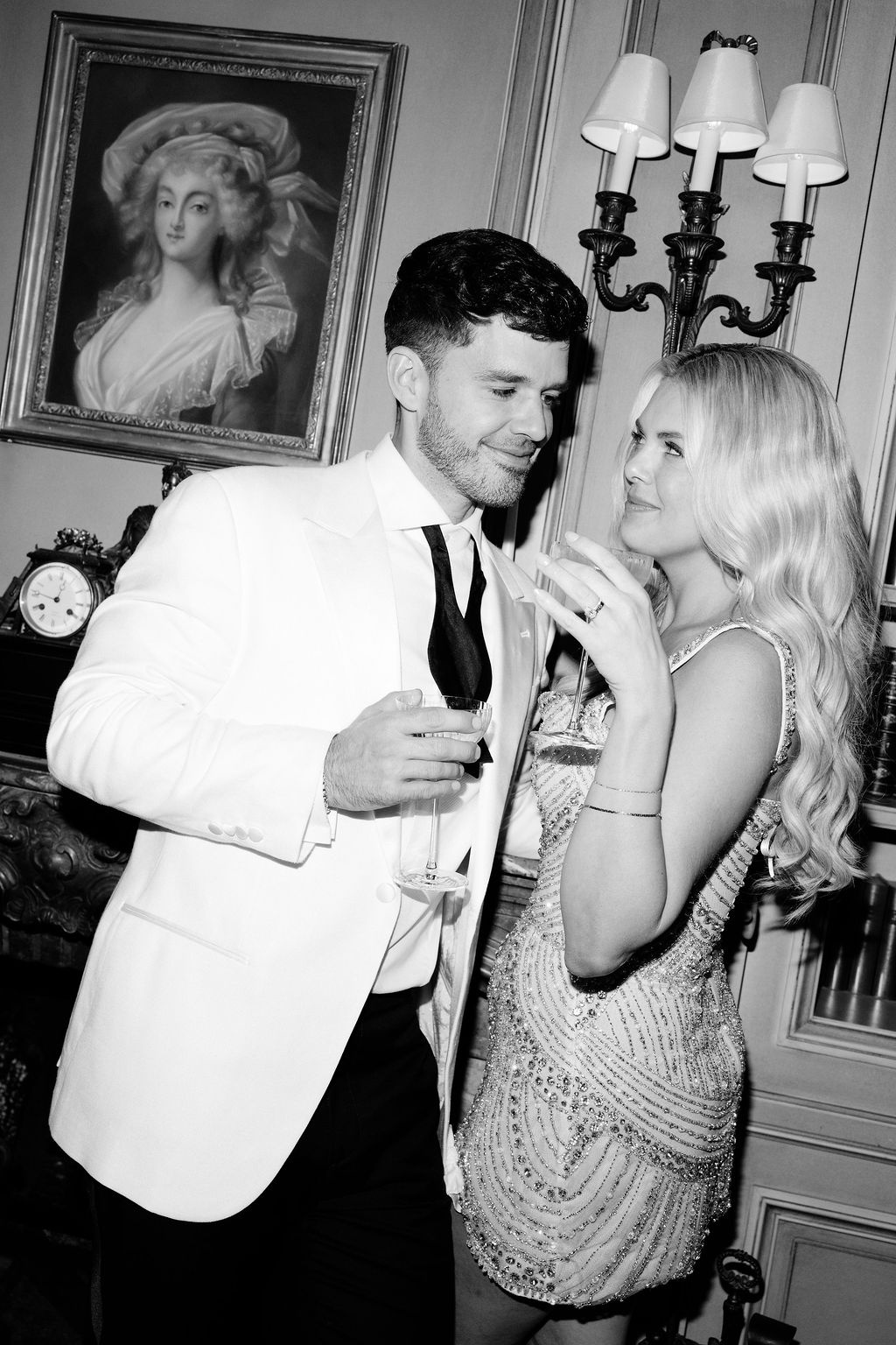 Black and white couple with champagne at Airelles Gordes La Bastide, Provence