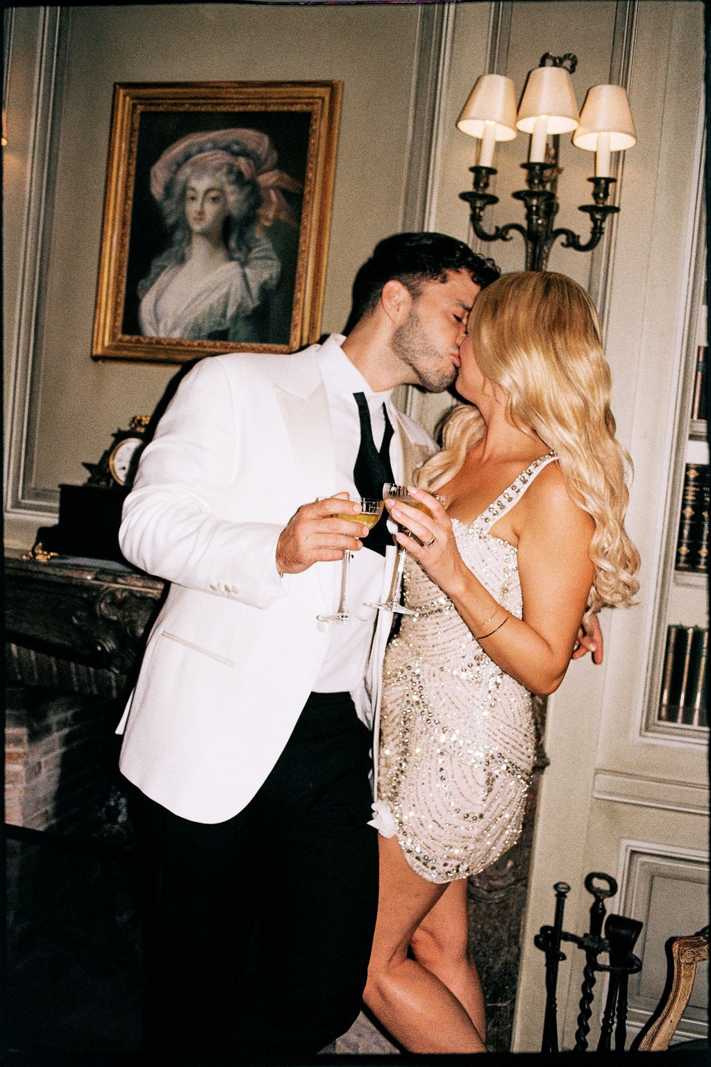 Couple kissing with champagne at Airelles Gordes La Bastide, Provence