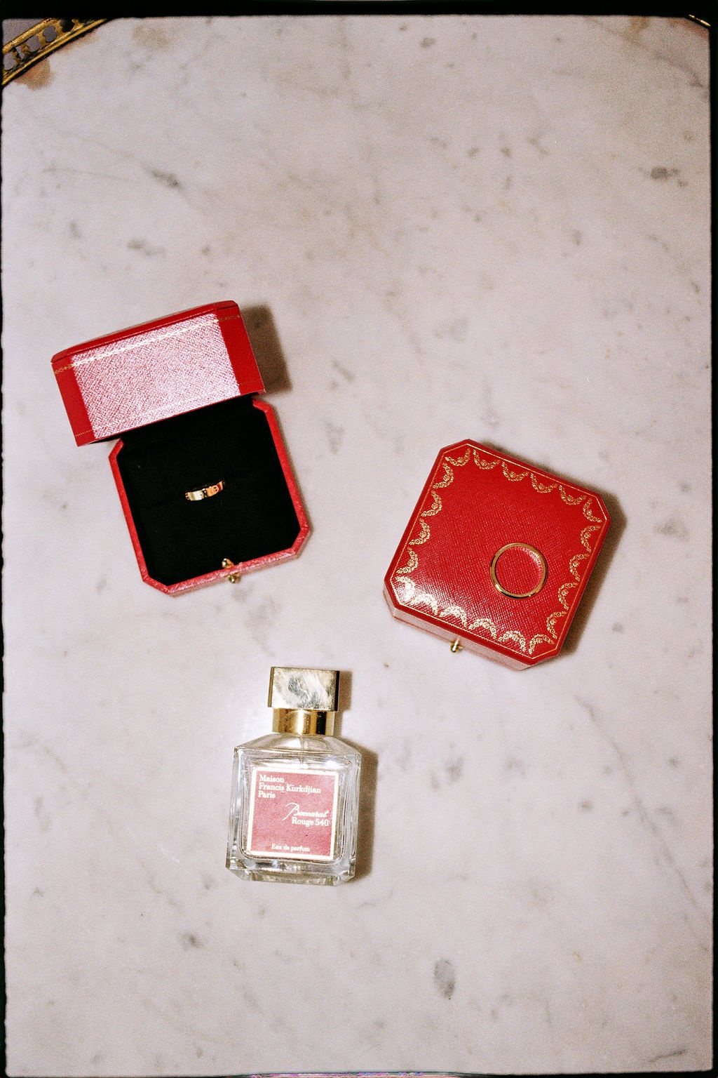 Wedding rings and perfume flat lay at Airelles Gordes La Bastide, Provence
