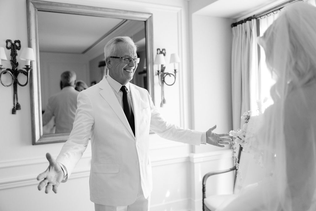 Father first look with bride in getting-ready suite at Airelles Gordes La Bastide, Provence
