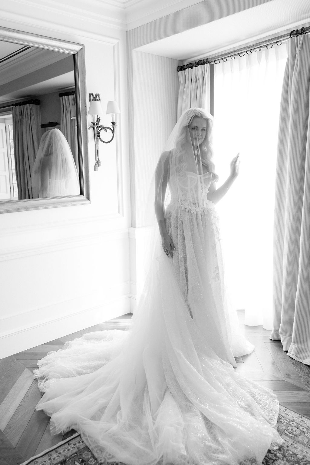 Black and white bridal portrait with lace gown and veil at Airelles Gordes La Bastide, Provence