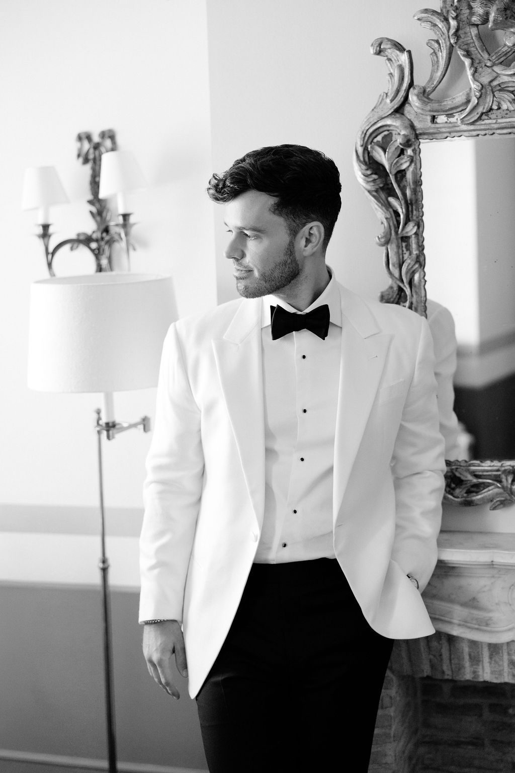 Black and white groom portrait at Airelles Gordes La Bastide, Provence