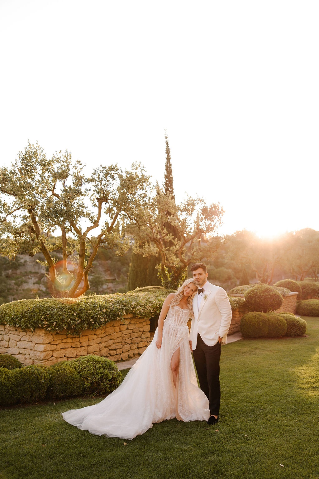Bride leaning on groom at golden hour at Airelles Gordes La Bastide, Provence