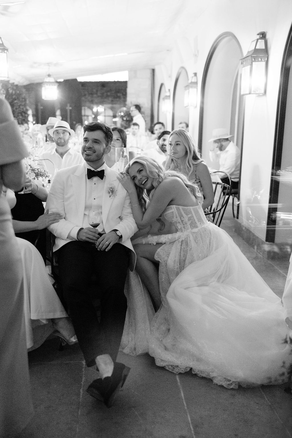Bride leaning on groom during reception speech at Airelles Gordes La Bastide, Provence