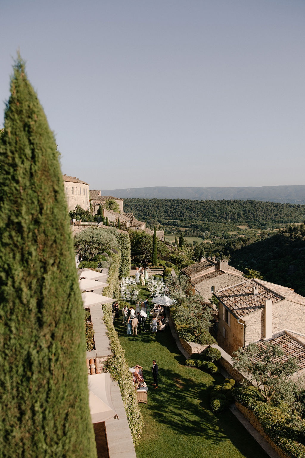 Aerial garden view with cypress and parasols at Airelles Gordes La Bastide, Provence
