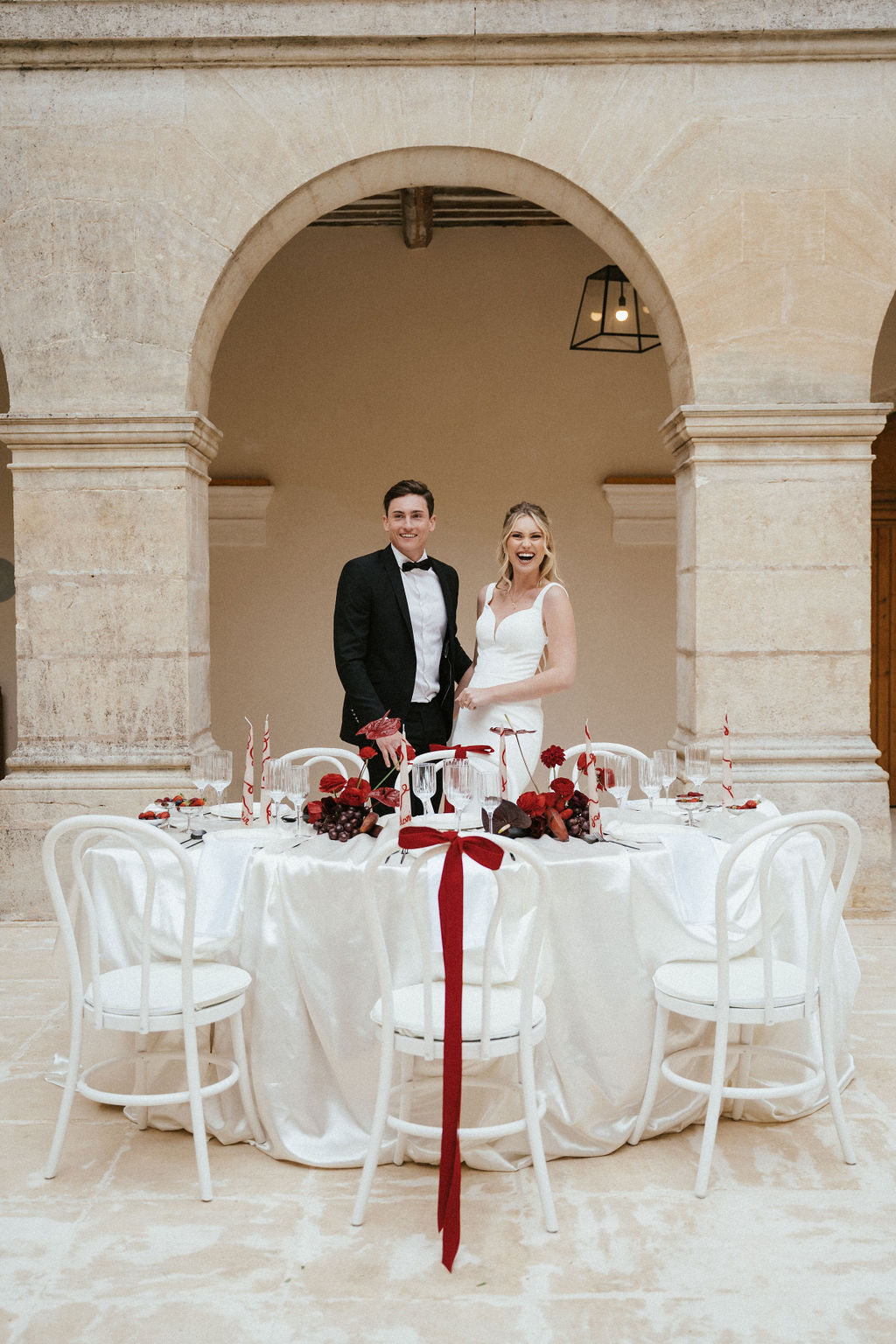 Crimson Ranunculus and Limestone Arches at Couvent Notre-Dame des Pres