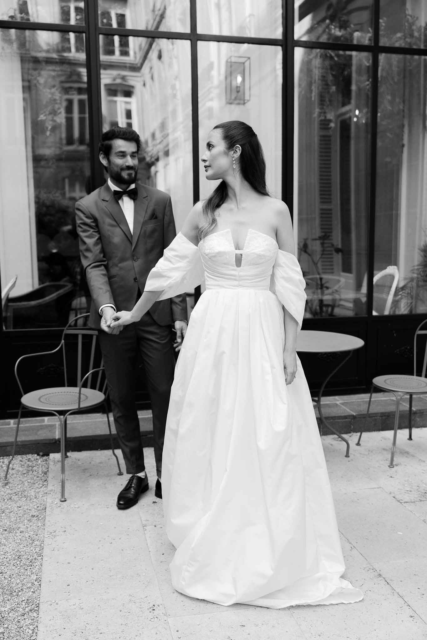 Black and white photo of bride and groom portrait in a garden