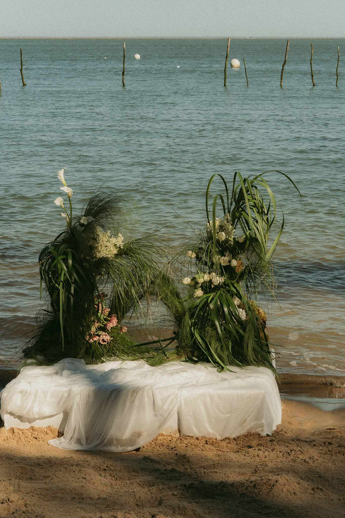 Wedding ceremony setup in a garden with white roses