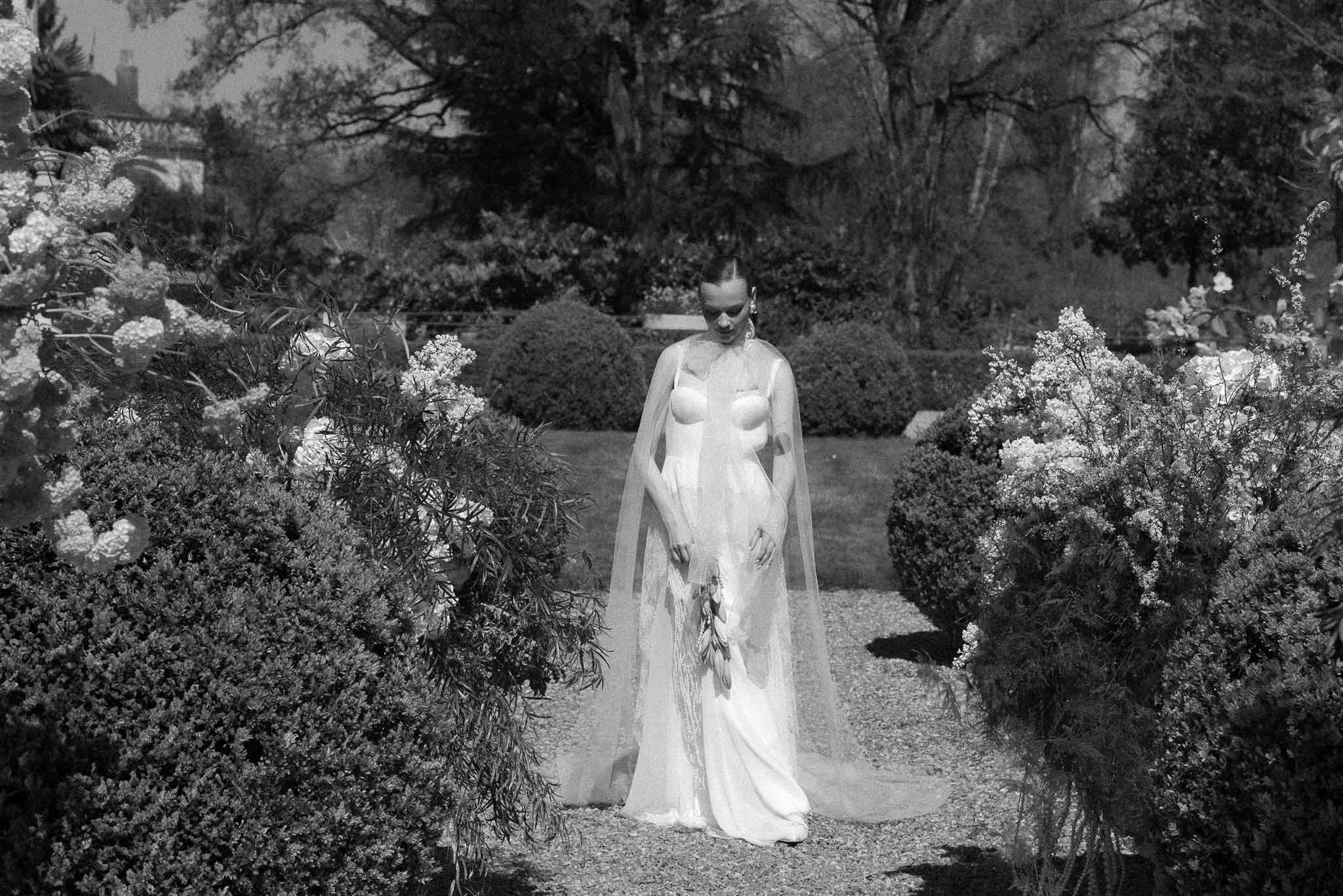 Black and white photo of bridal portrait in a garden