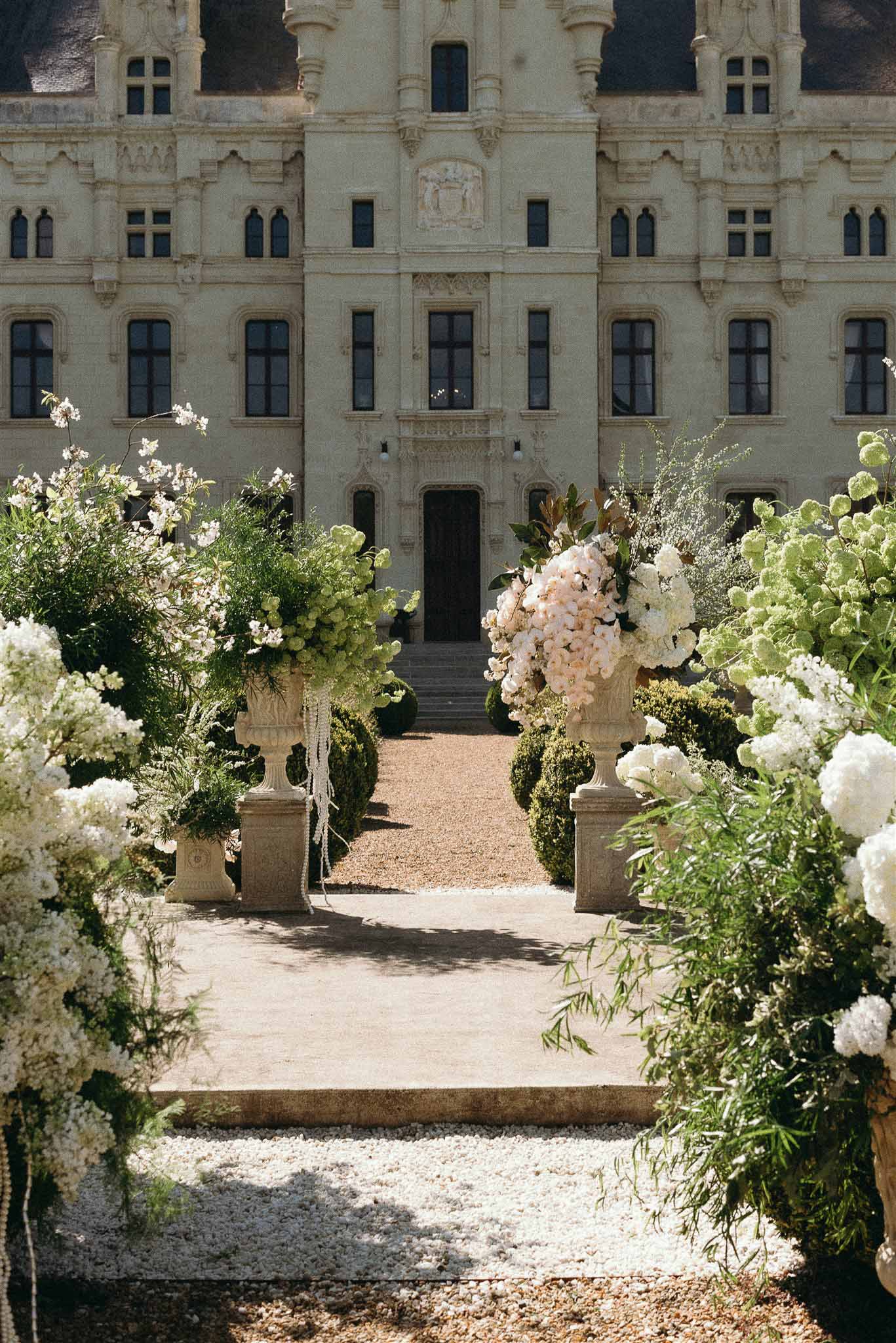Wedding ceremony setup in a garden with hydrangeas