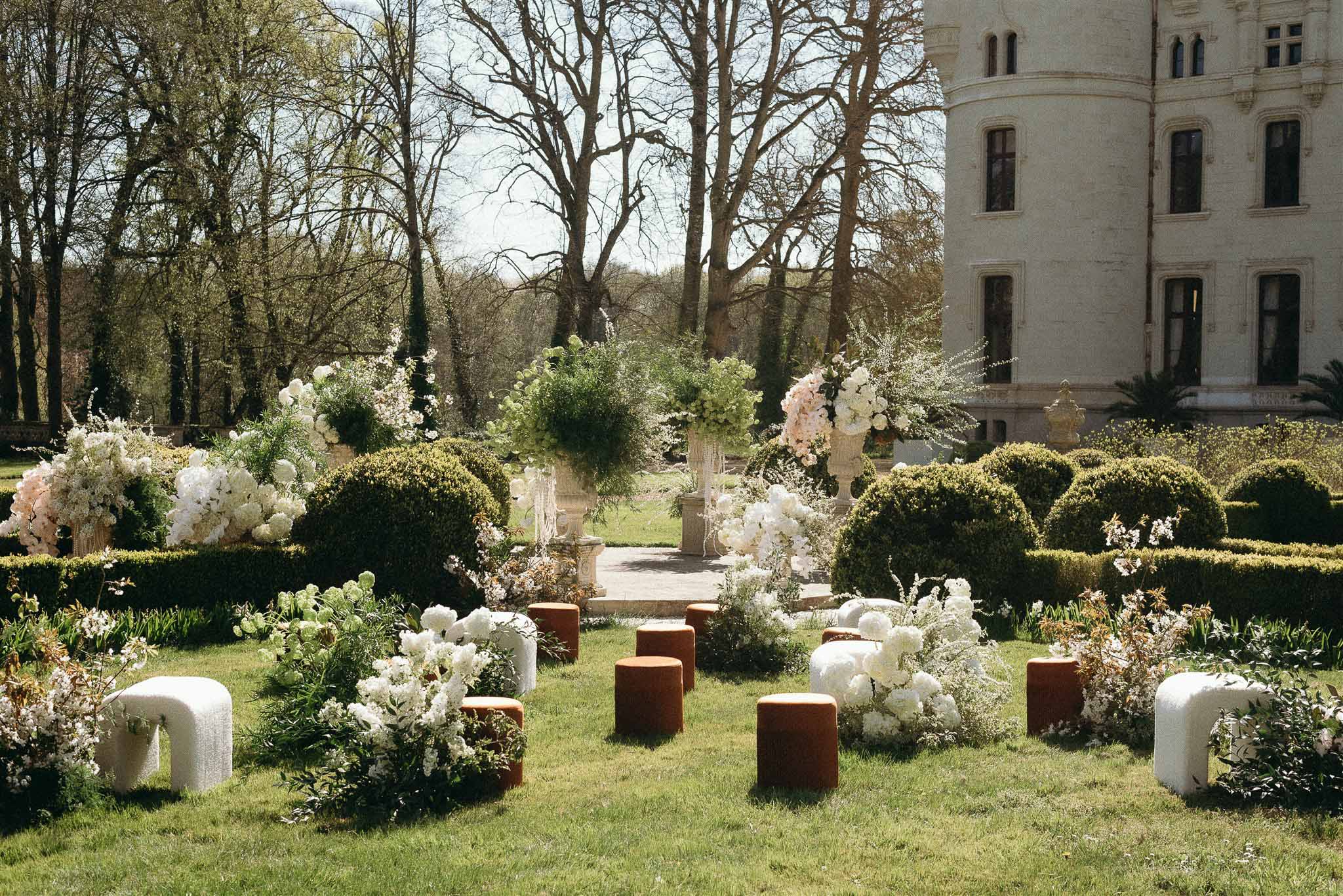 Wedding ceremony setup in a garden with hydrangeas