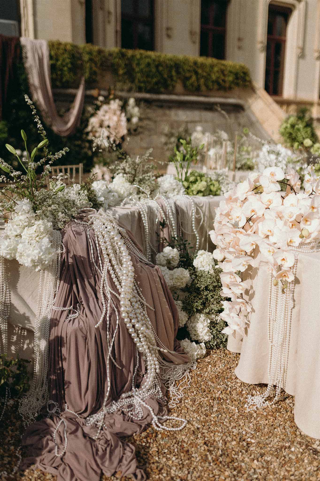 Wedding reception table setting in a garden with hydrangeas