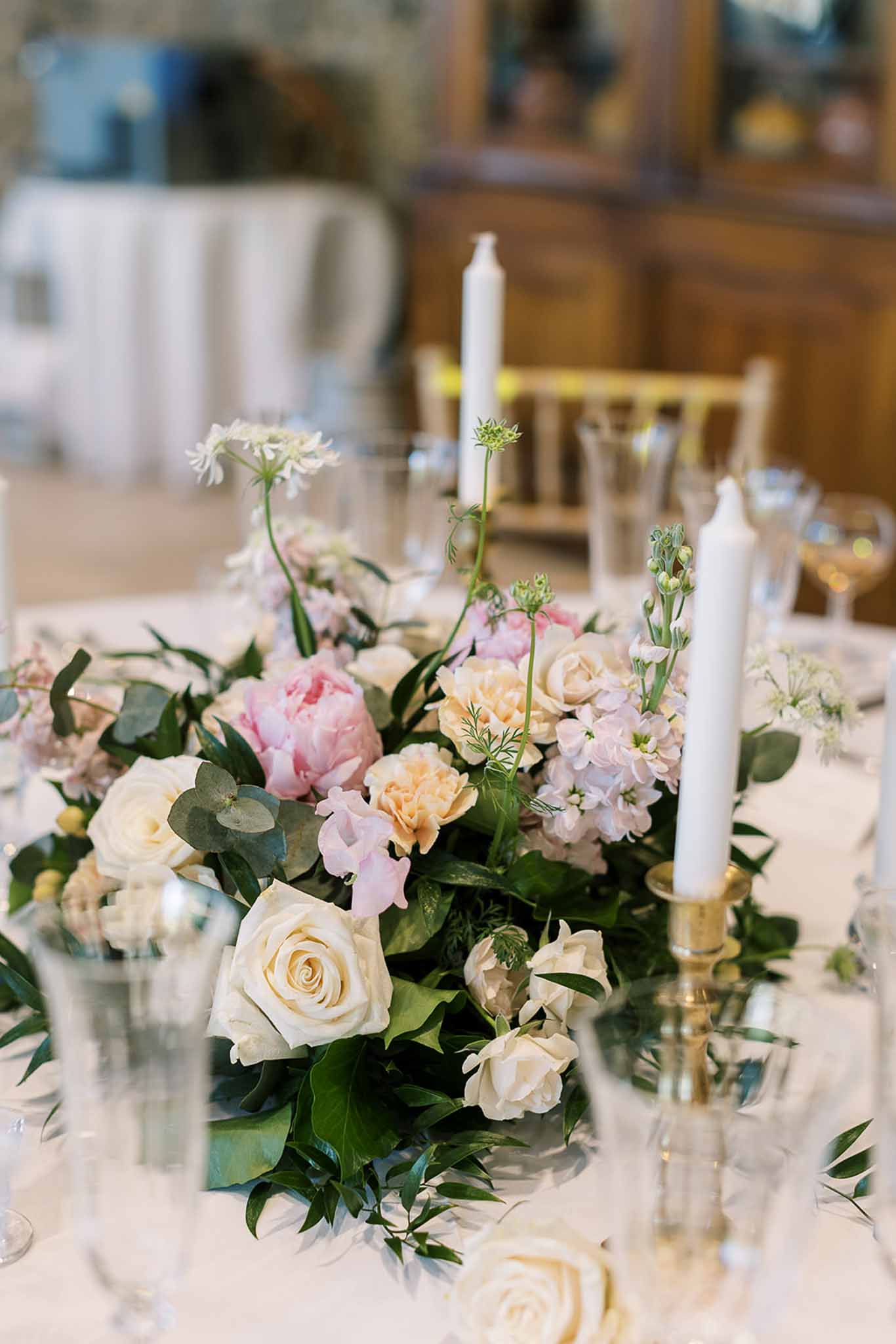 Wedding reception table setting in a garden with white roses