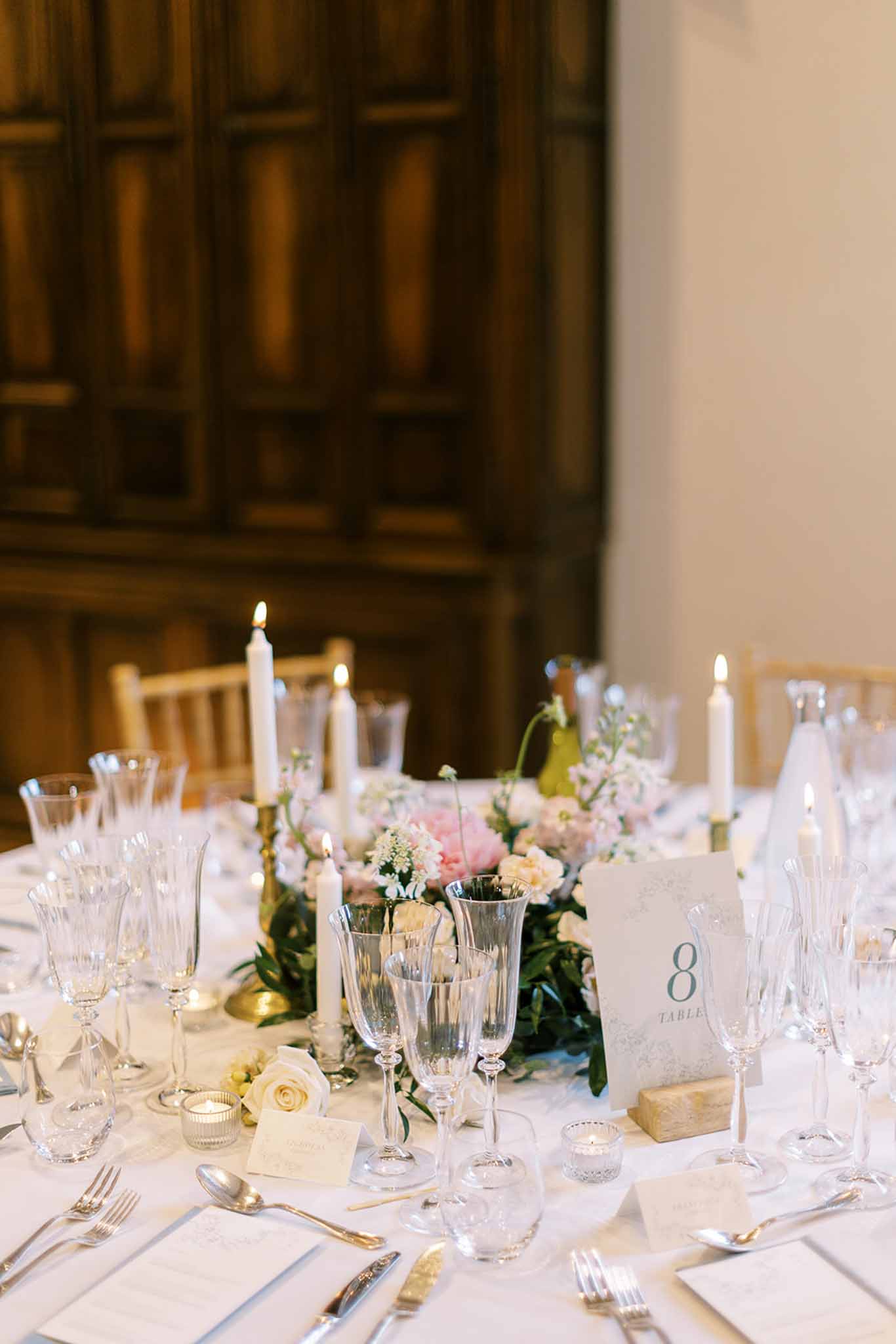 Wedding reception table setting in a garden with white roses