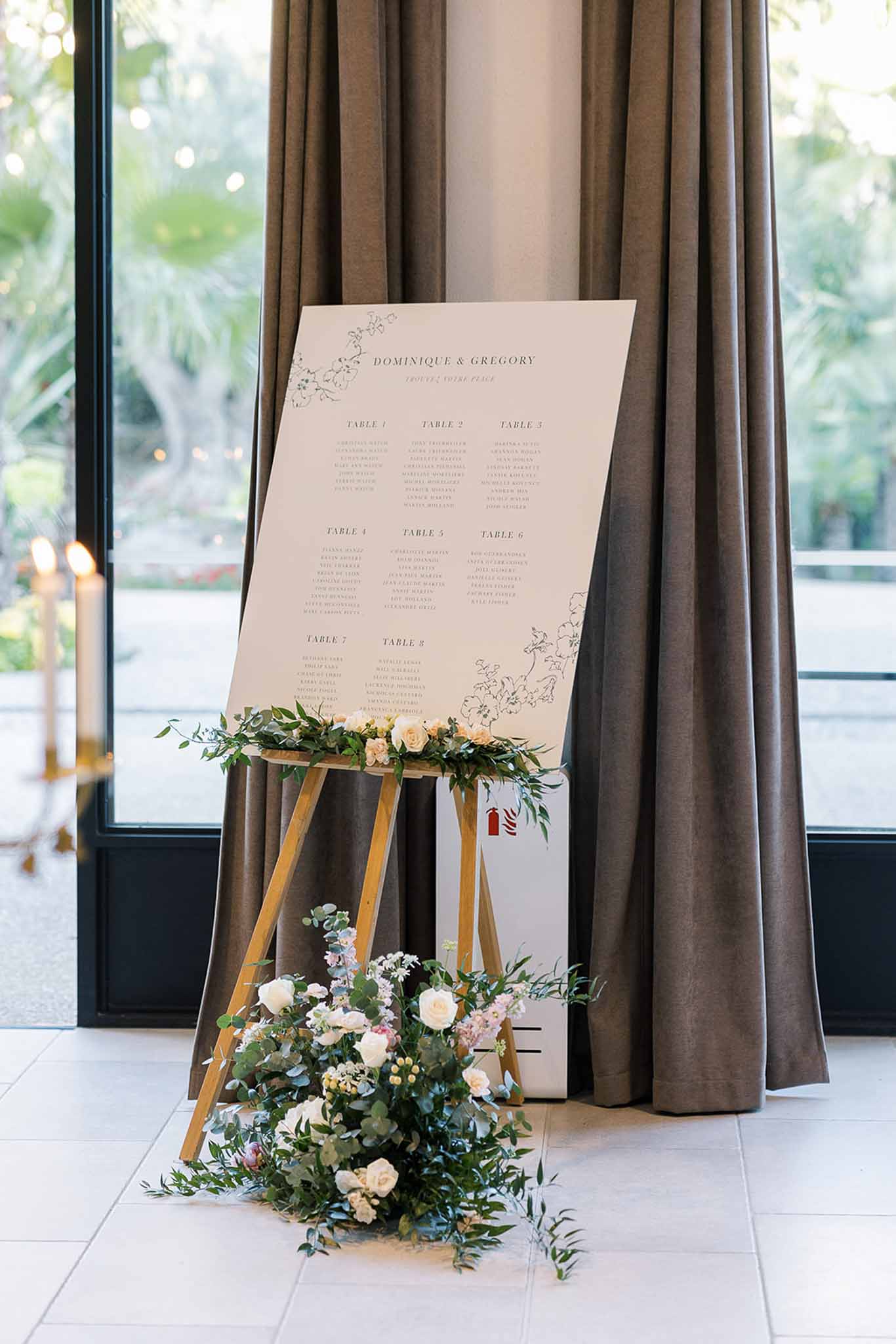 Wedding reception table setting in a garden with white roses