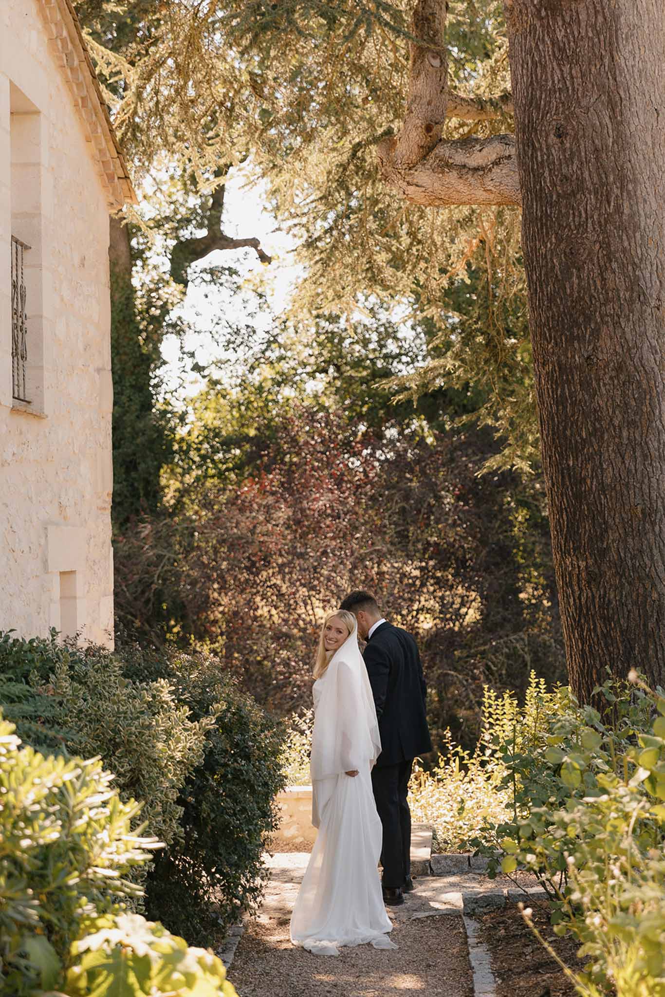 Bride and groom portrait in a garden