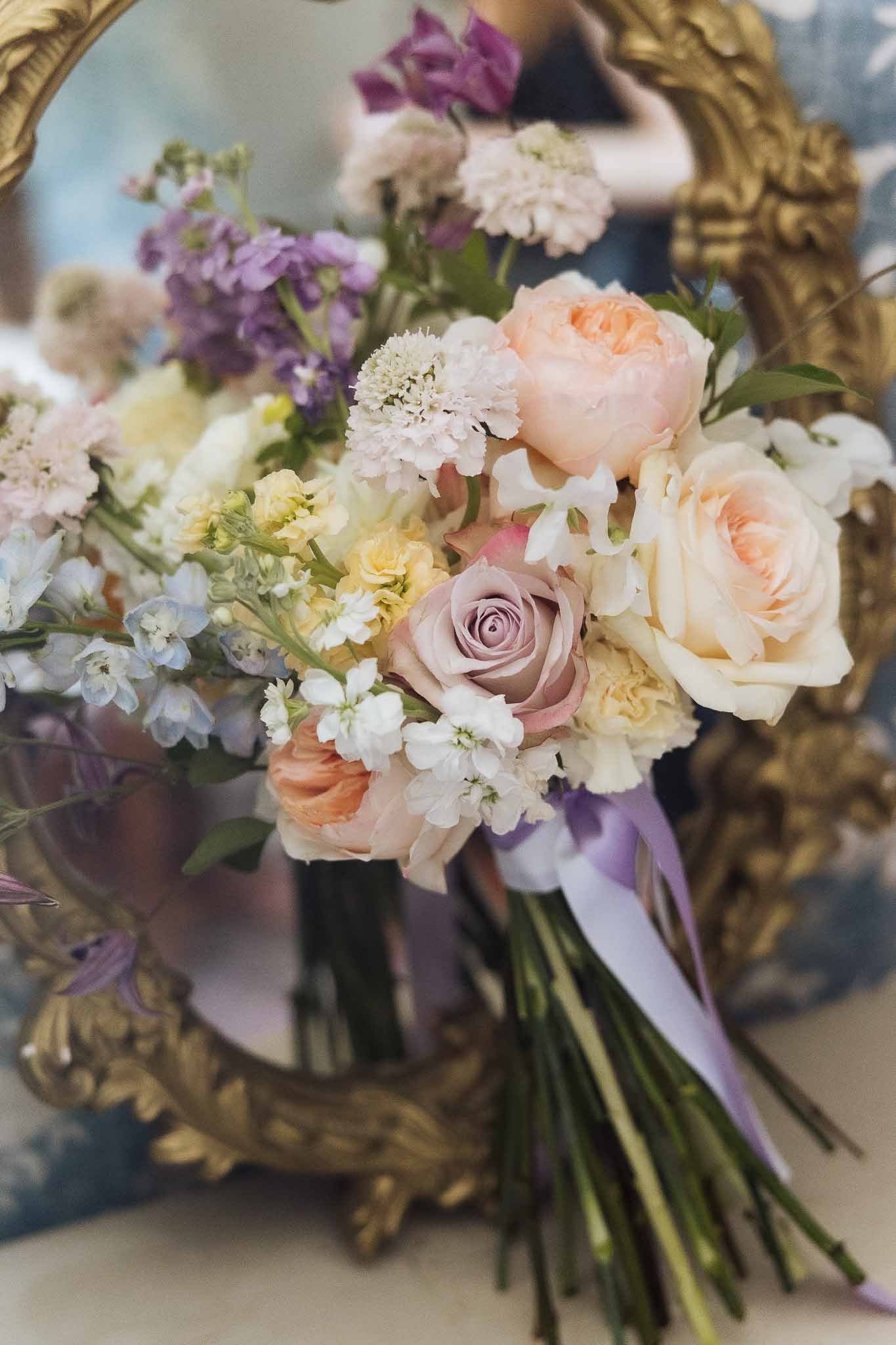 Wedding bouquet in a garden with white roses