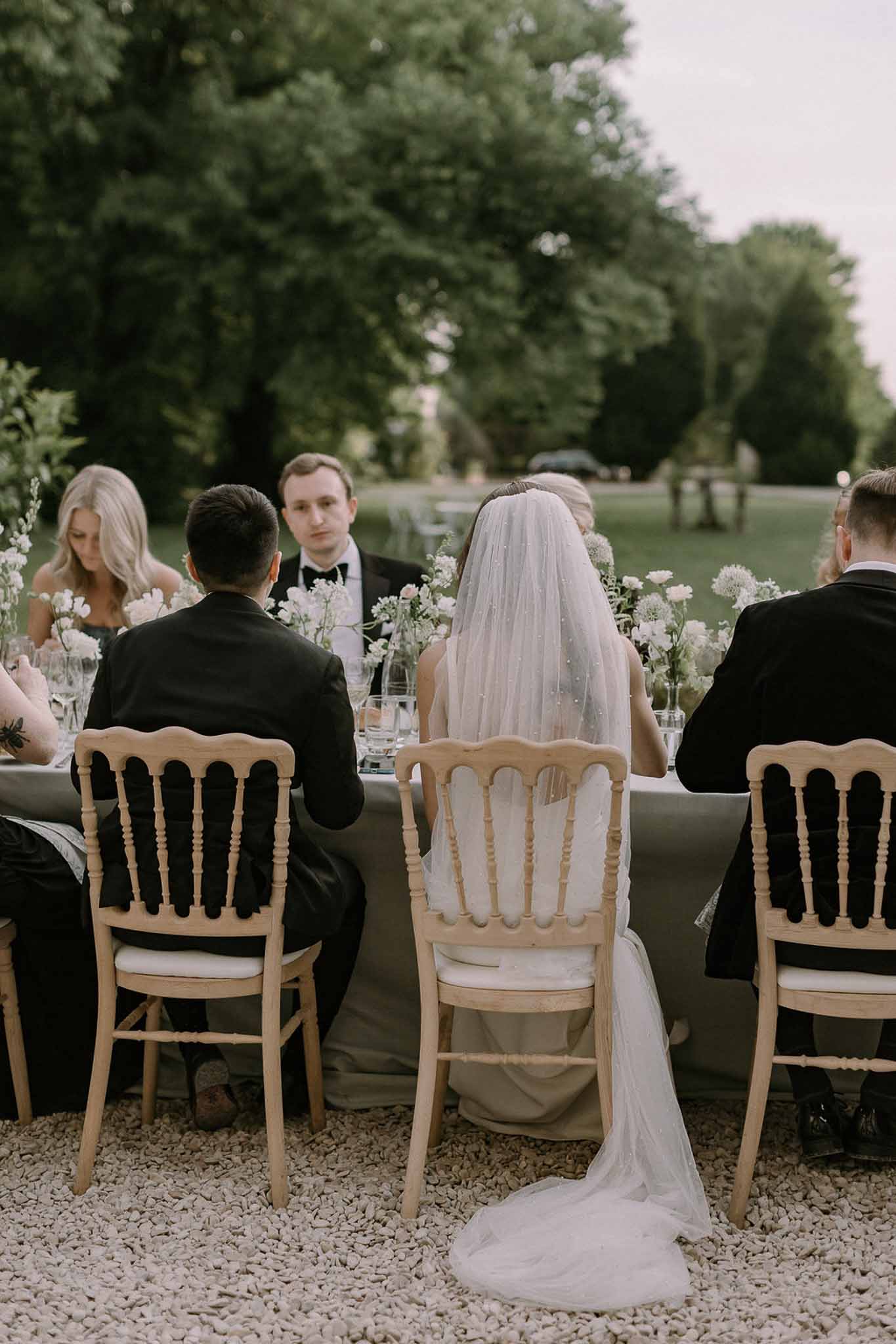 Wedding reception table setting with white roses