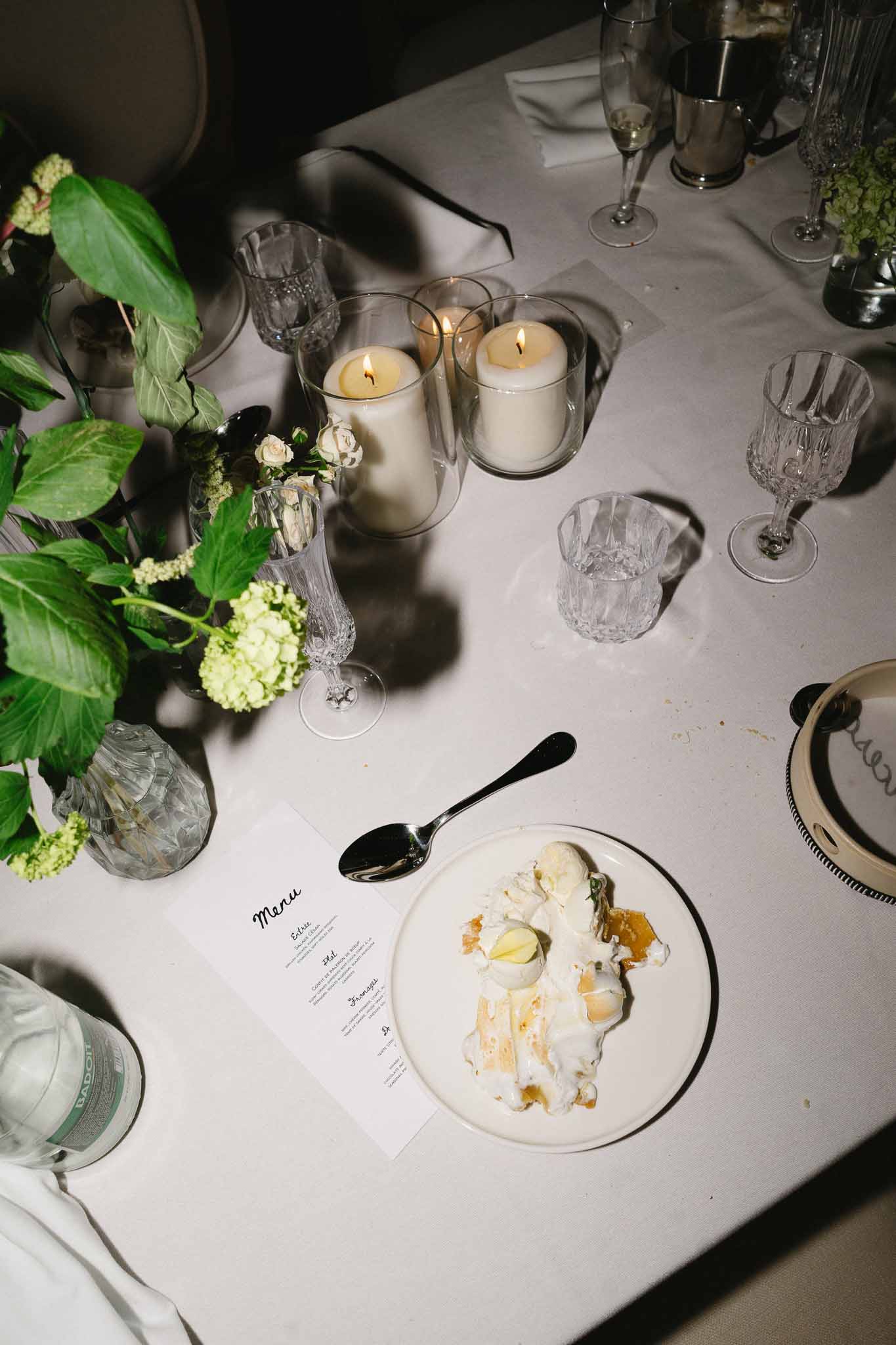Wedding reception table setting with white roses