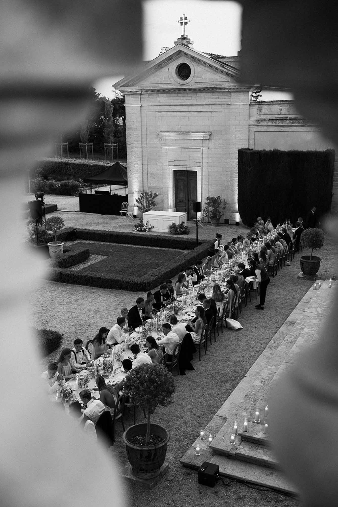 Black and white photo of wedding ceremony in a chapel