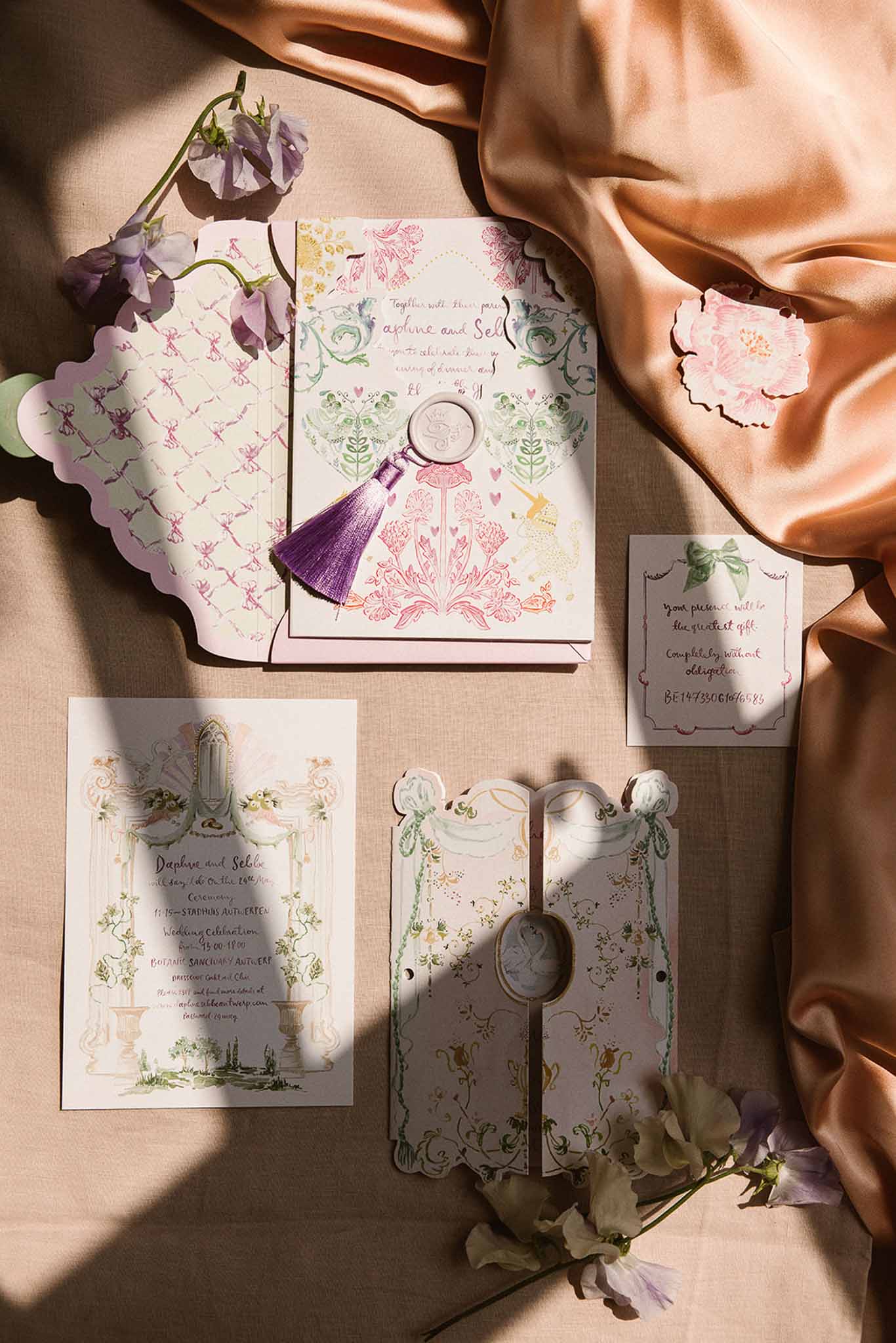 Illustrated pastel stationery suite with wax seal, scalloped cards, and sweet pea flowers on linen