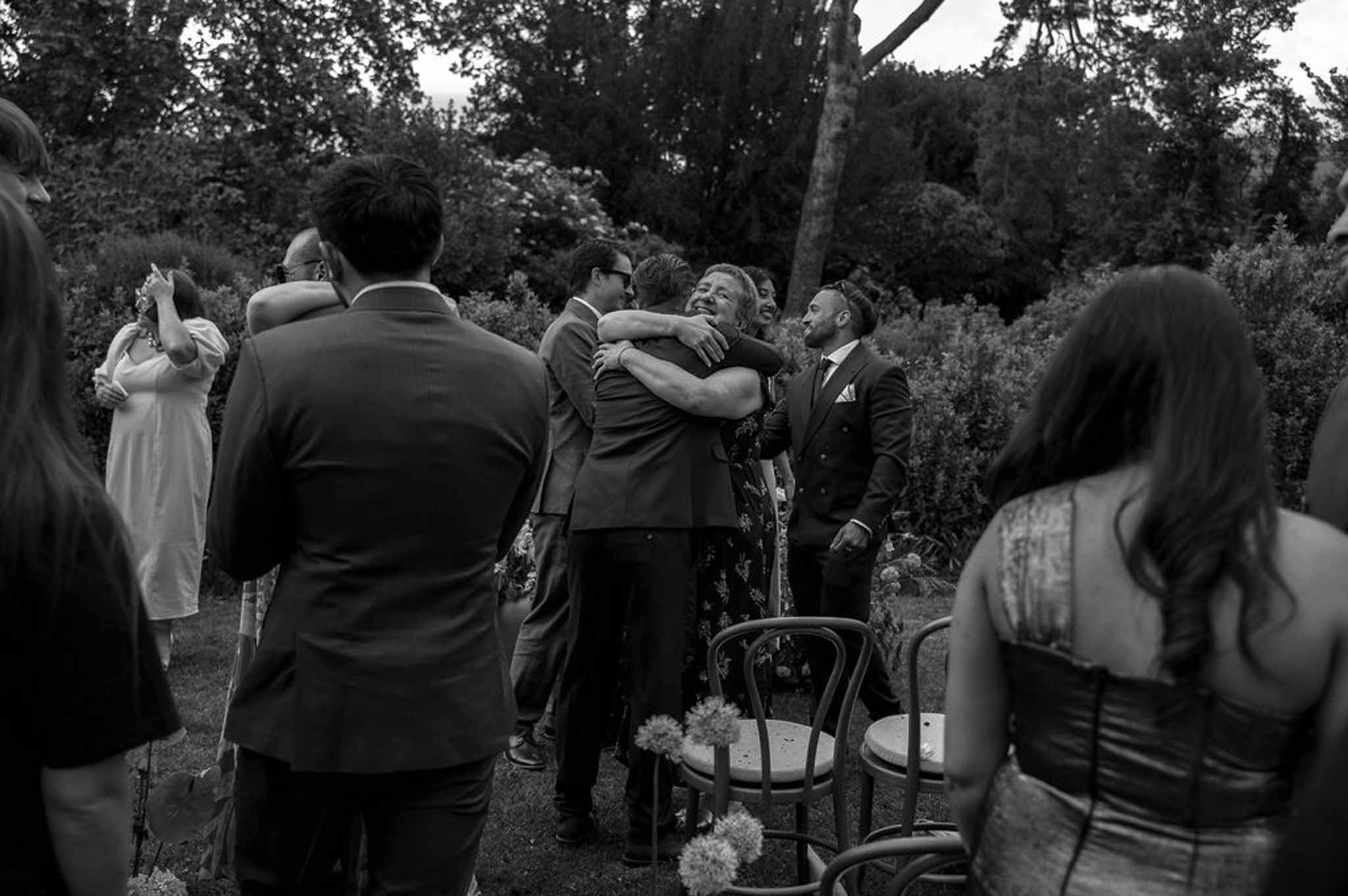 Black and white photo of wedding ceremony in a garden