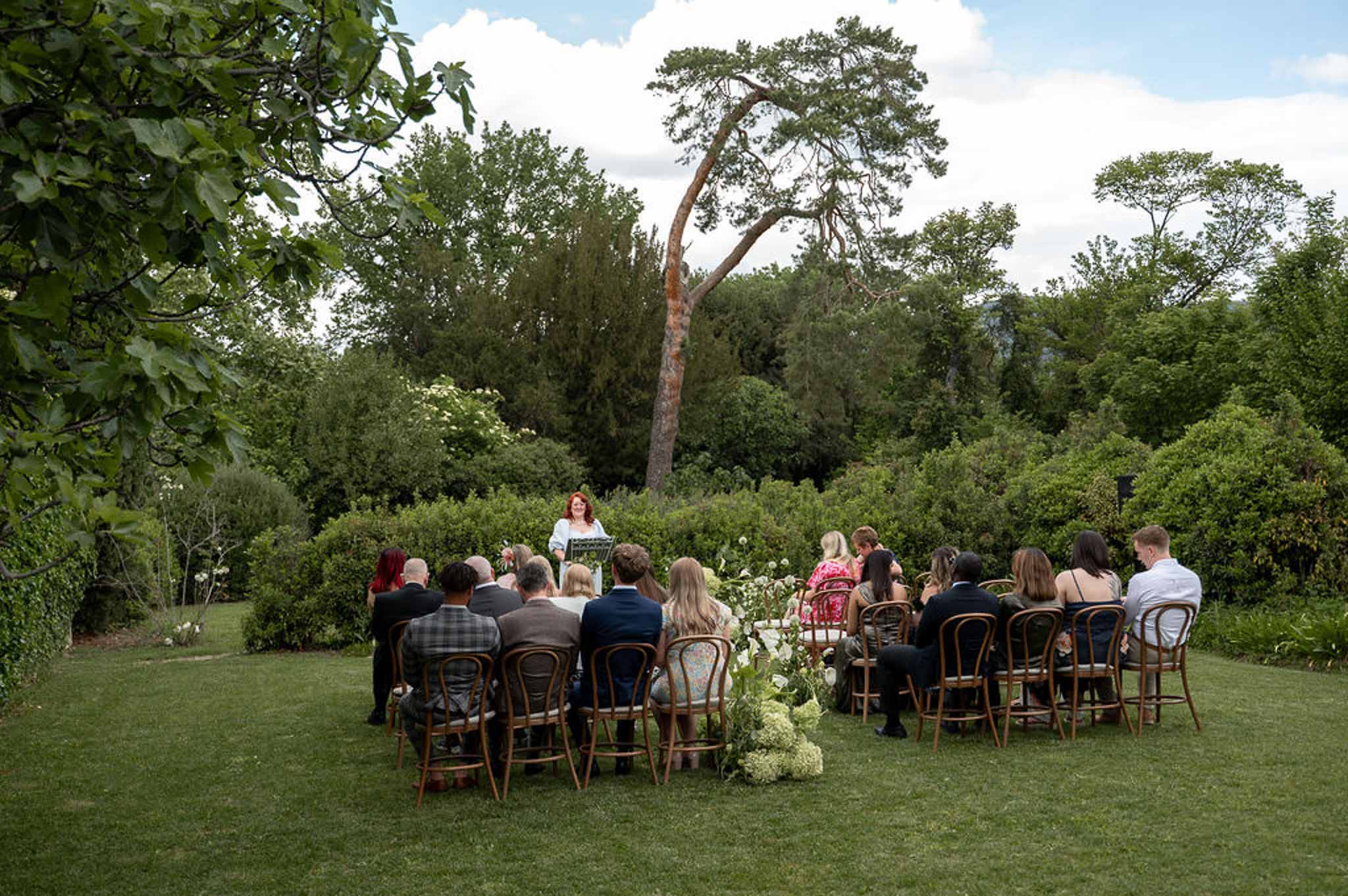 Wedding ceremony in a garden with hydrangeas