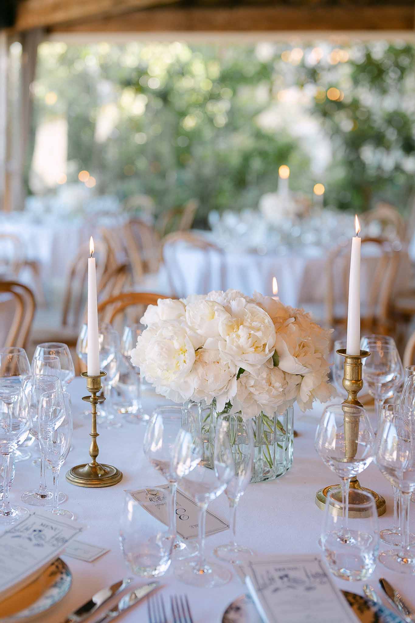 Wedding reception table setting with peonies