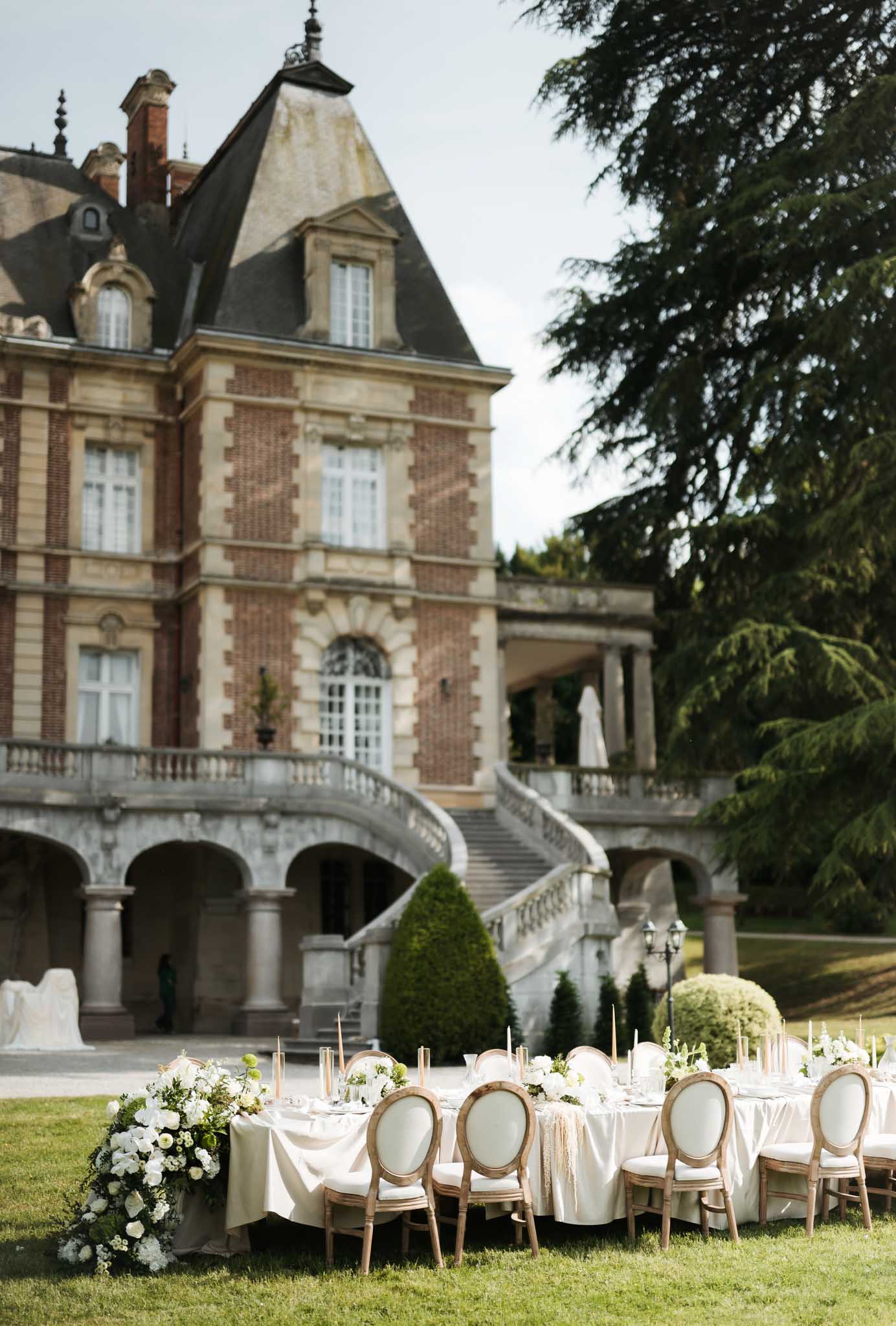 Wedding reception table setting with white roses
