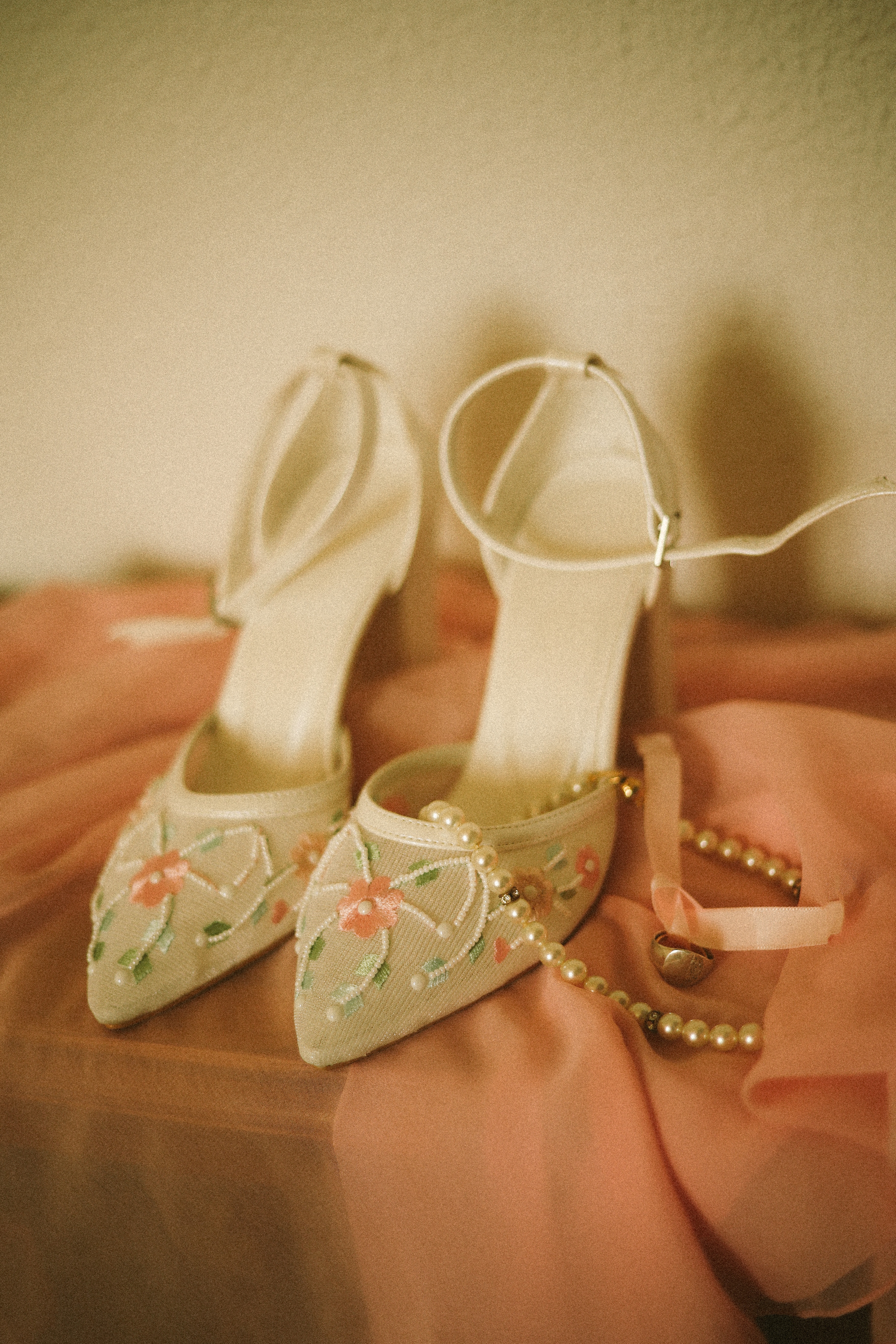 Embroidered bridal heels with pearl necklace at Chateau du Puits es Pratx, Ginestas