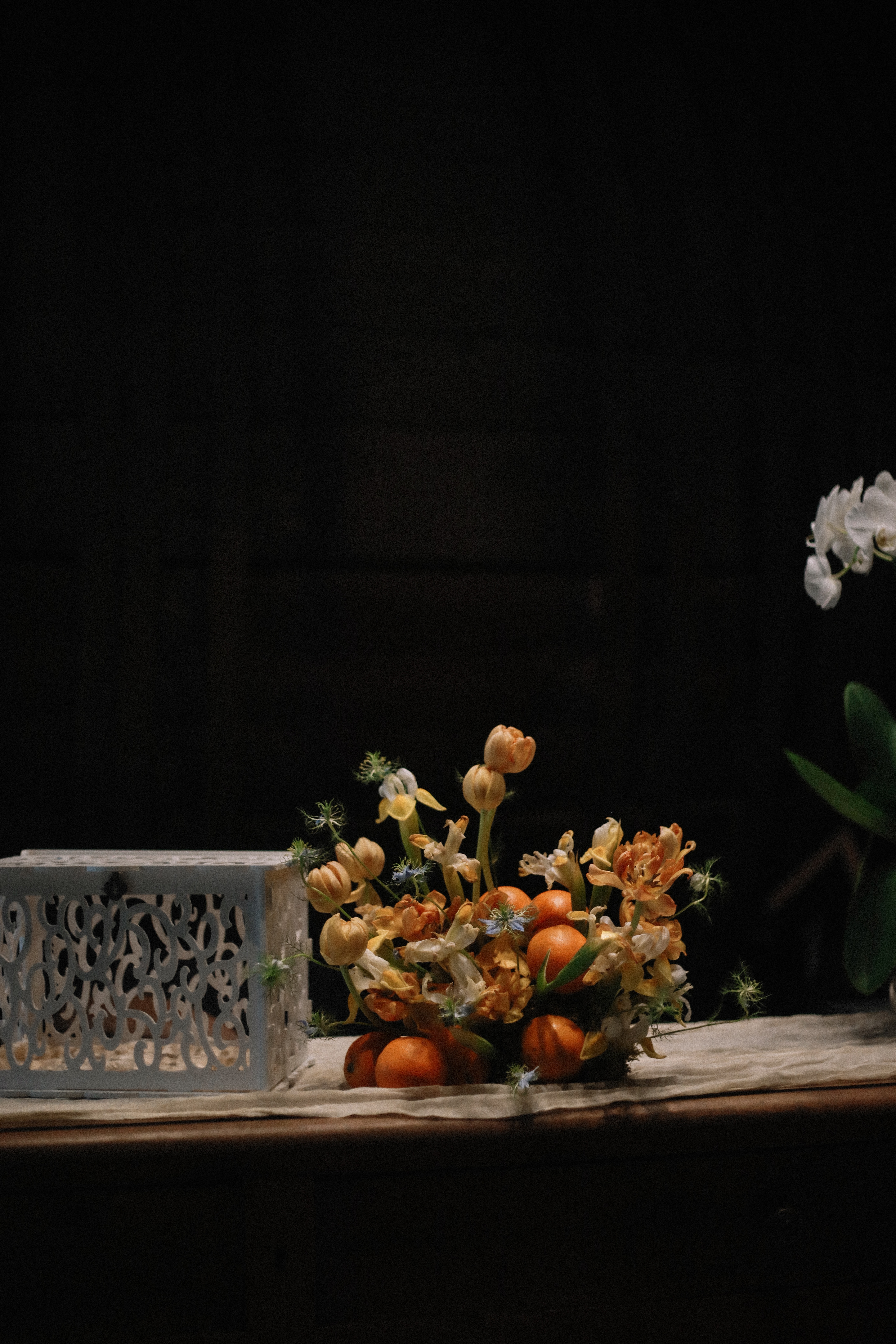 Floral and citrus centrepiece with card box at Chateau du Puits es Pratx, Ginestas