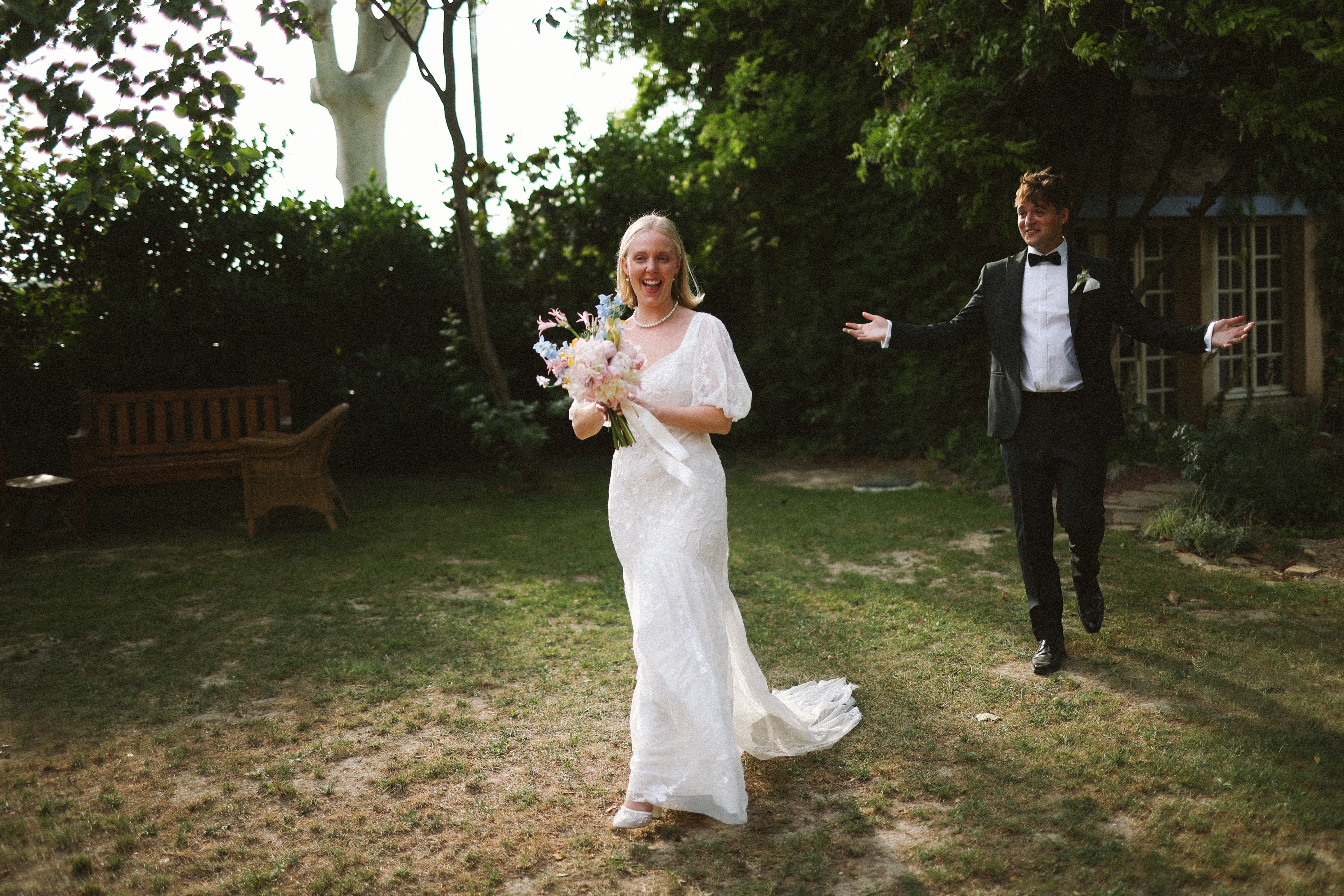 Couple cheering with bouquet in garden at Chateau du Puits es Pratx, Ginestas